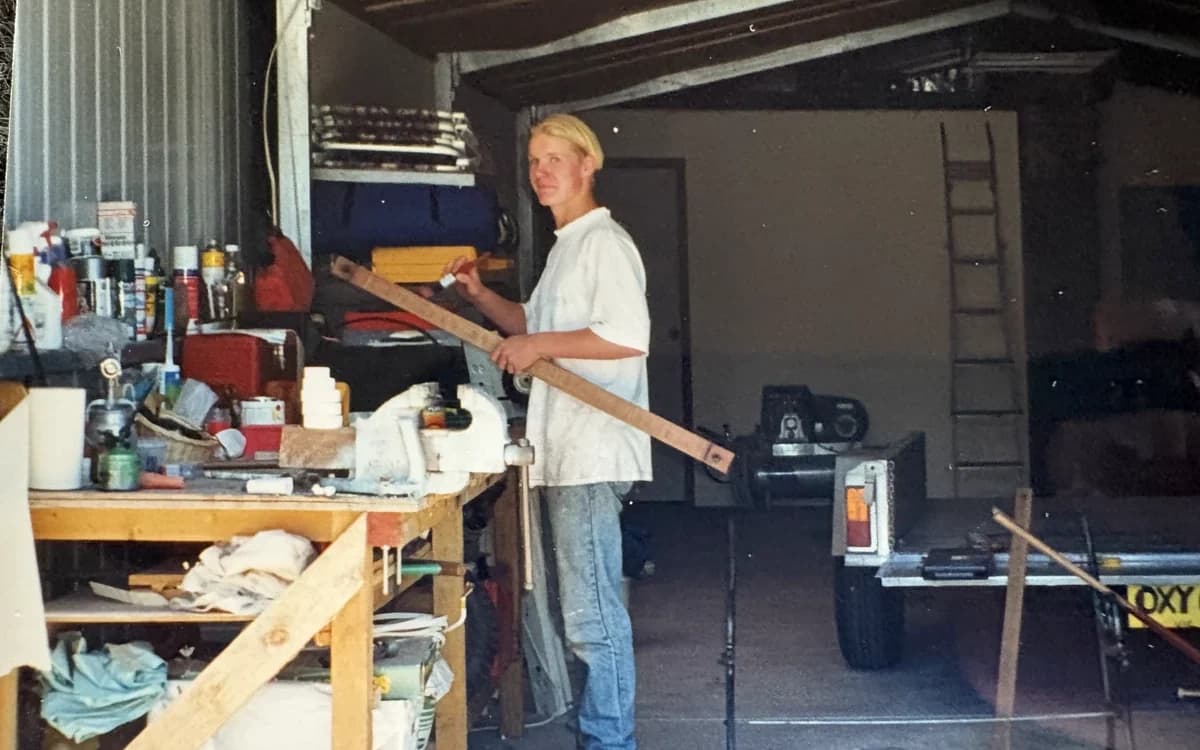 Richie Foster as a teenager working at a bench in his dad's shed