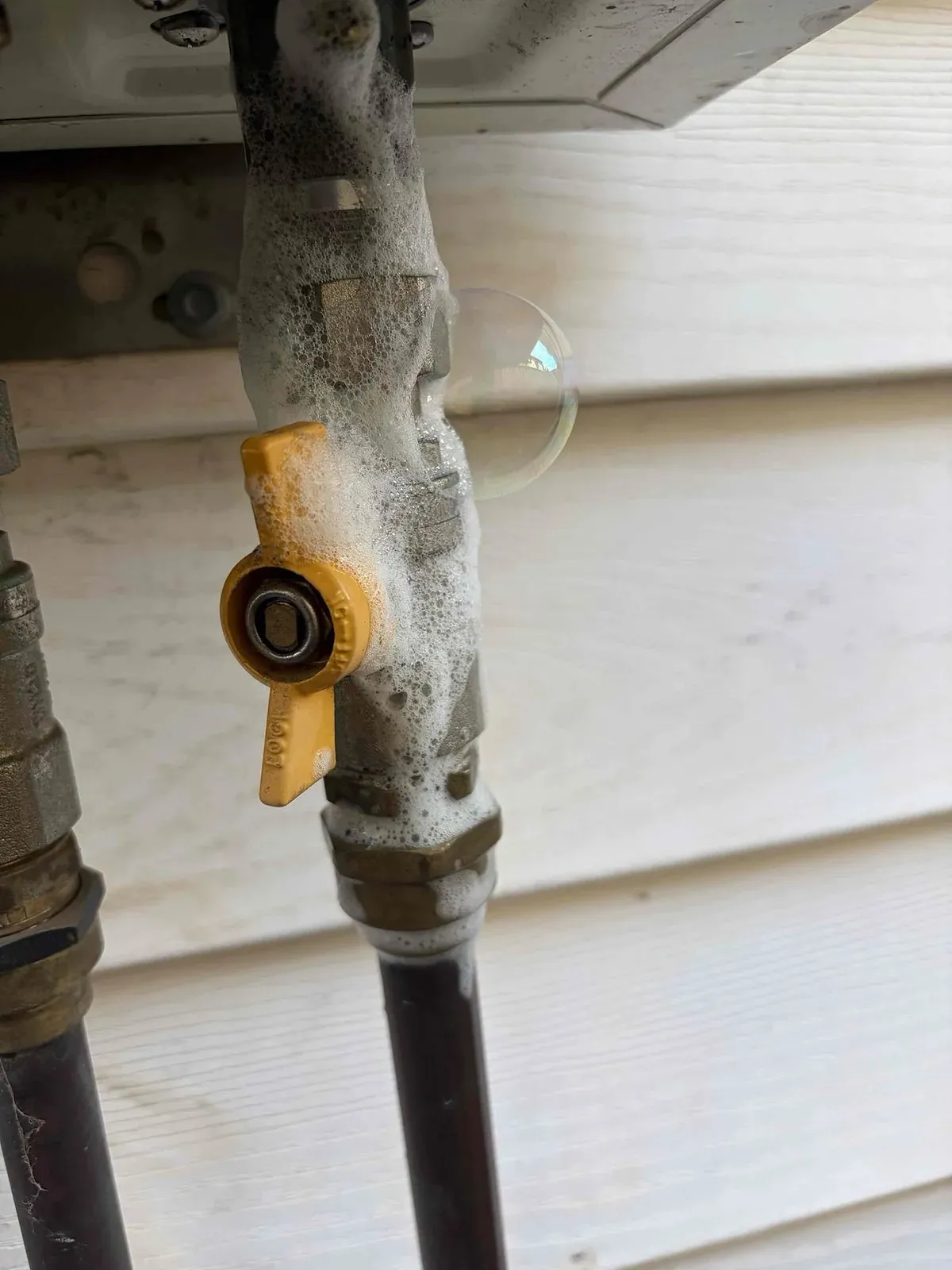 Gas valve and fittings on the hot water line