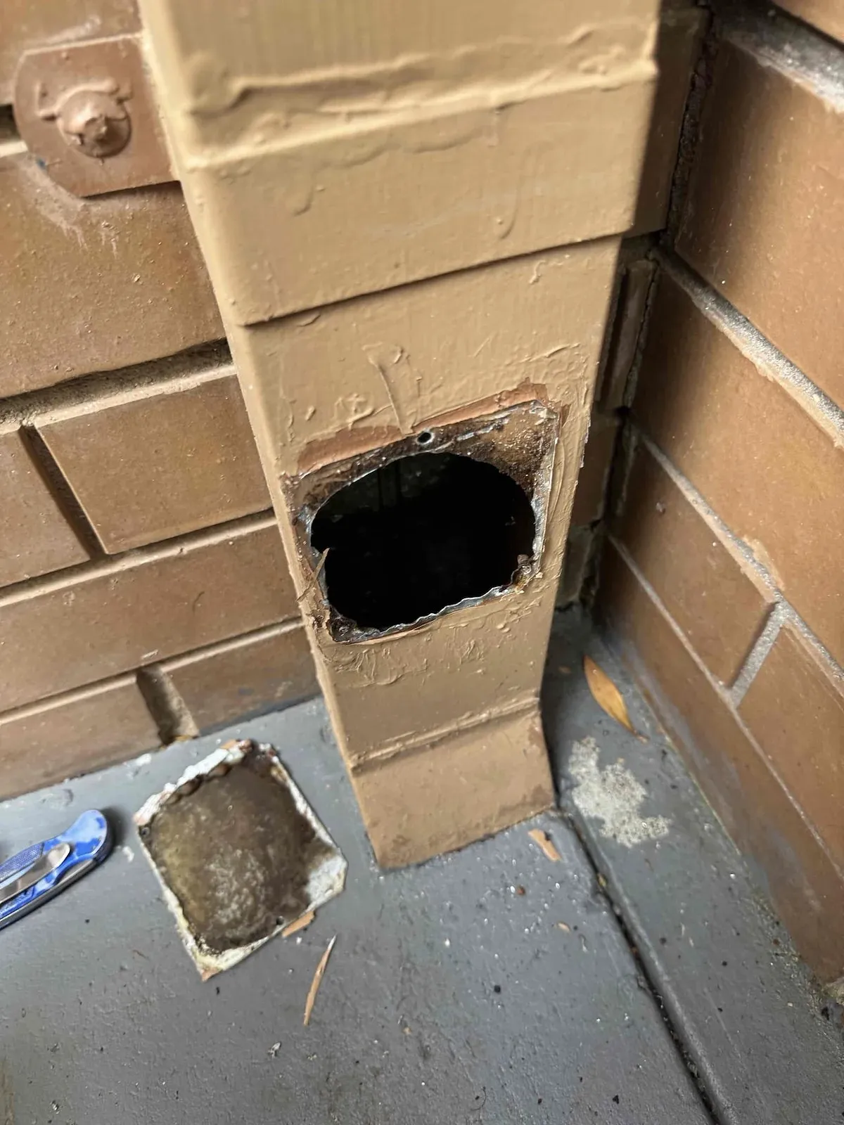 Downpipe opened up to inspect a stormwater blockage in Ballarat East