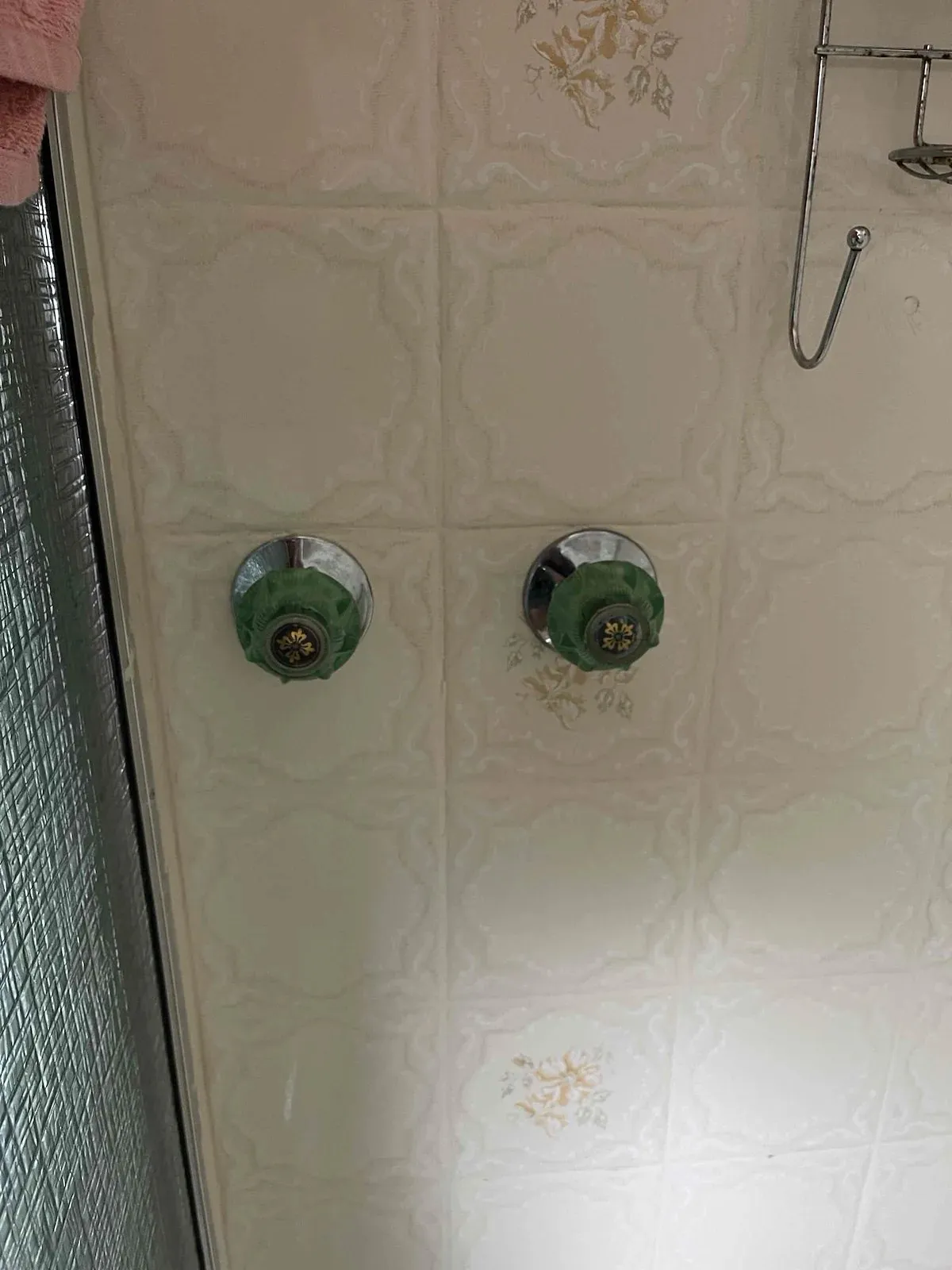 Shower wall with the tap handles removed