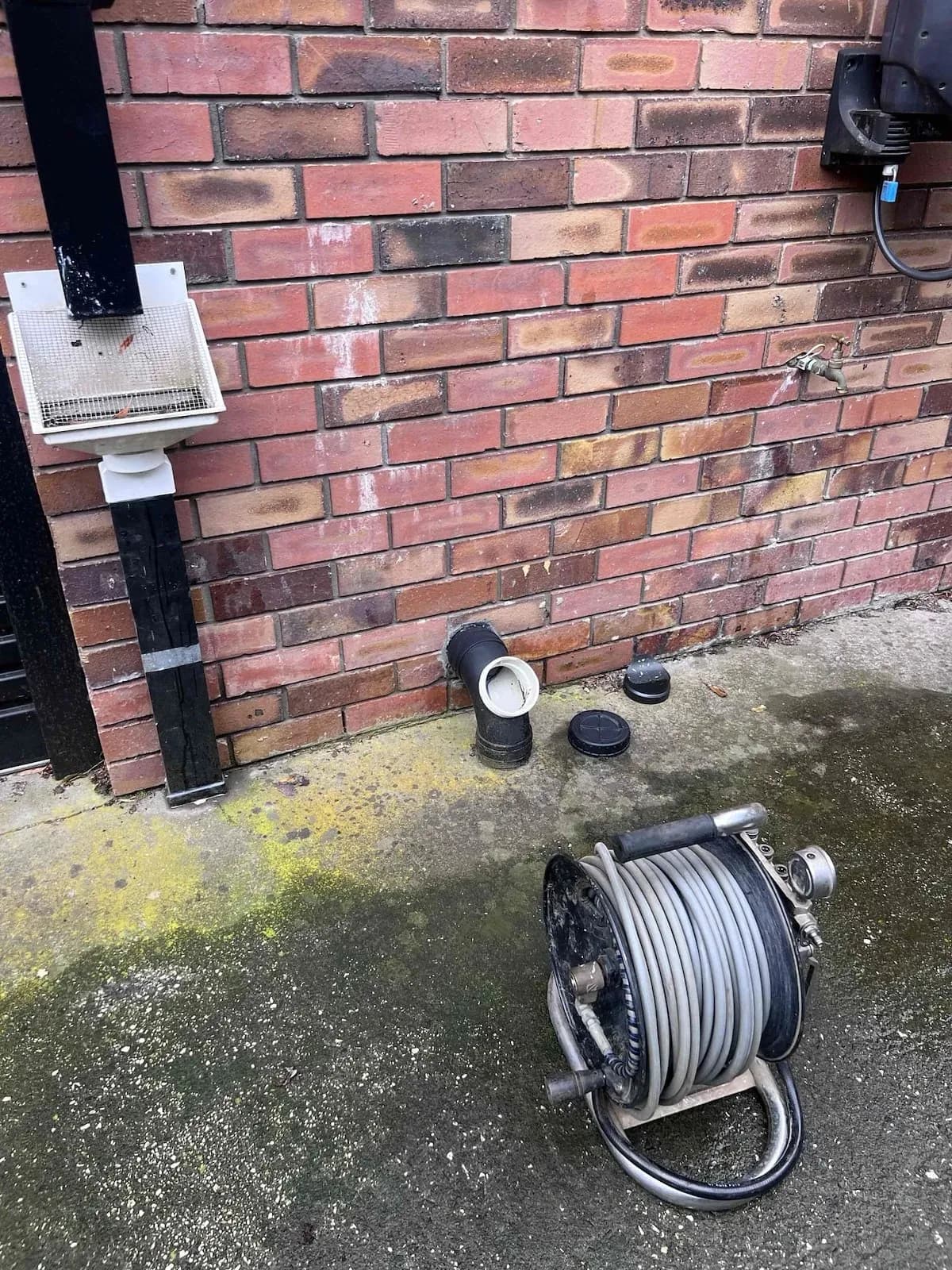 Drain jetter set up at an outside access point in Ballarat North
