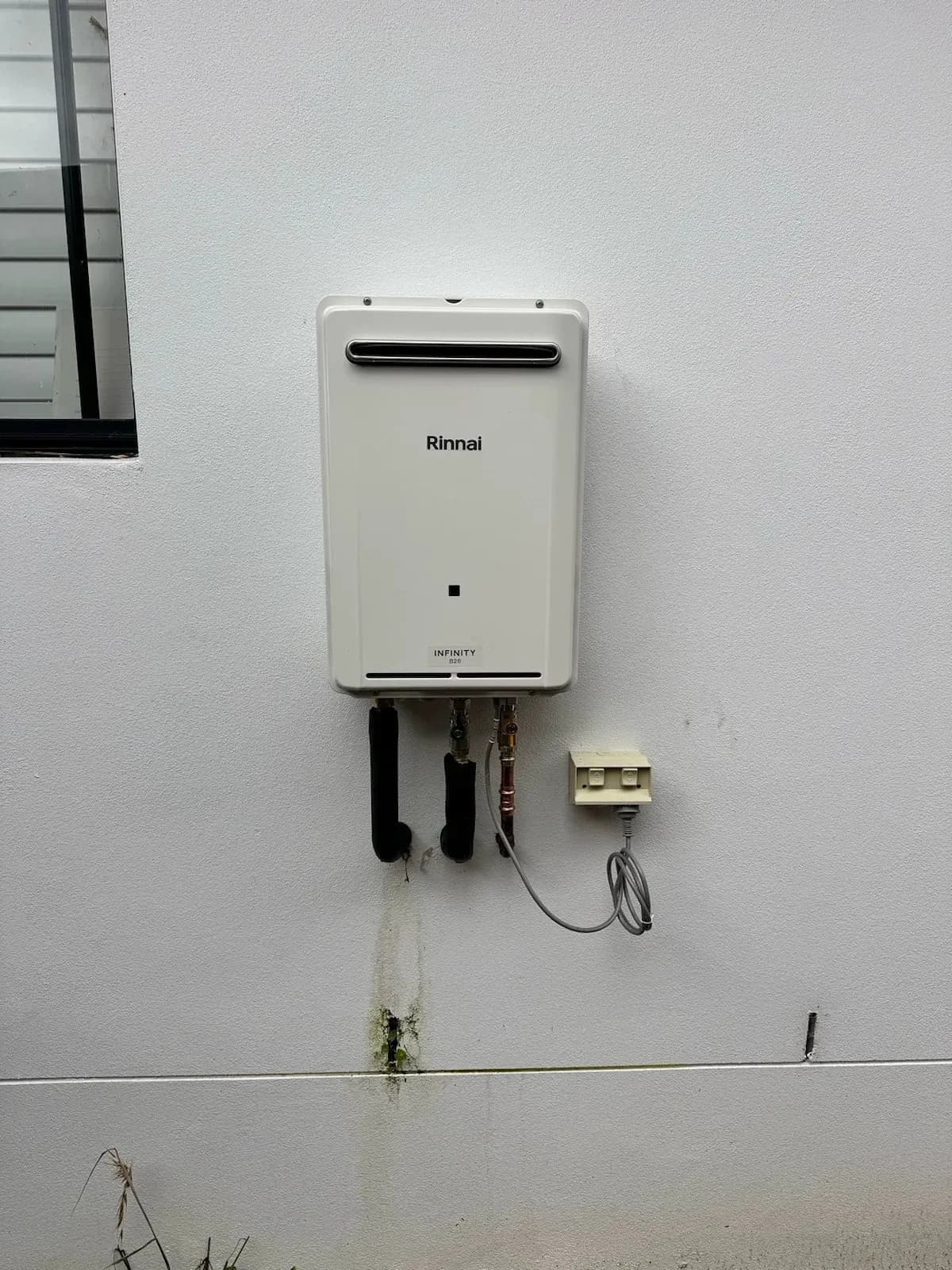 New continuous flow hot water unit on the wall