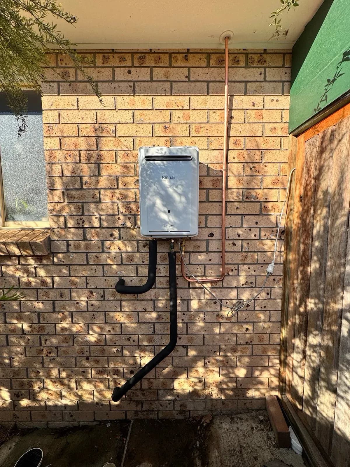 New continuous flow gas hot water unit on the wall
