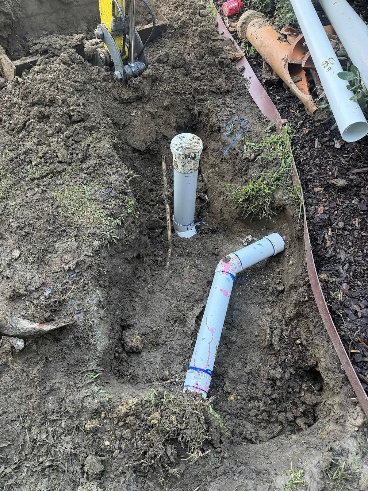 New PVC sewer pipe and inspection shaft in the trench