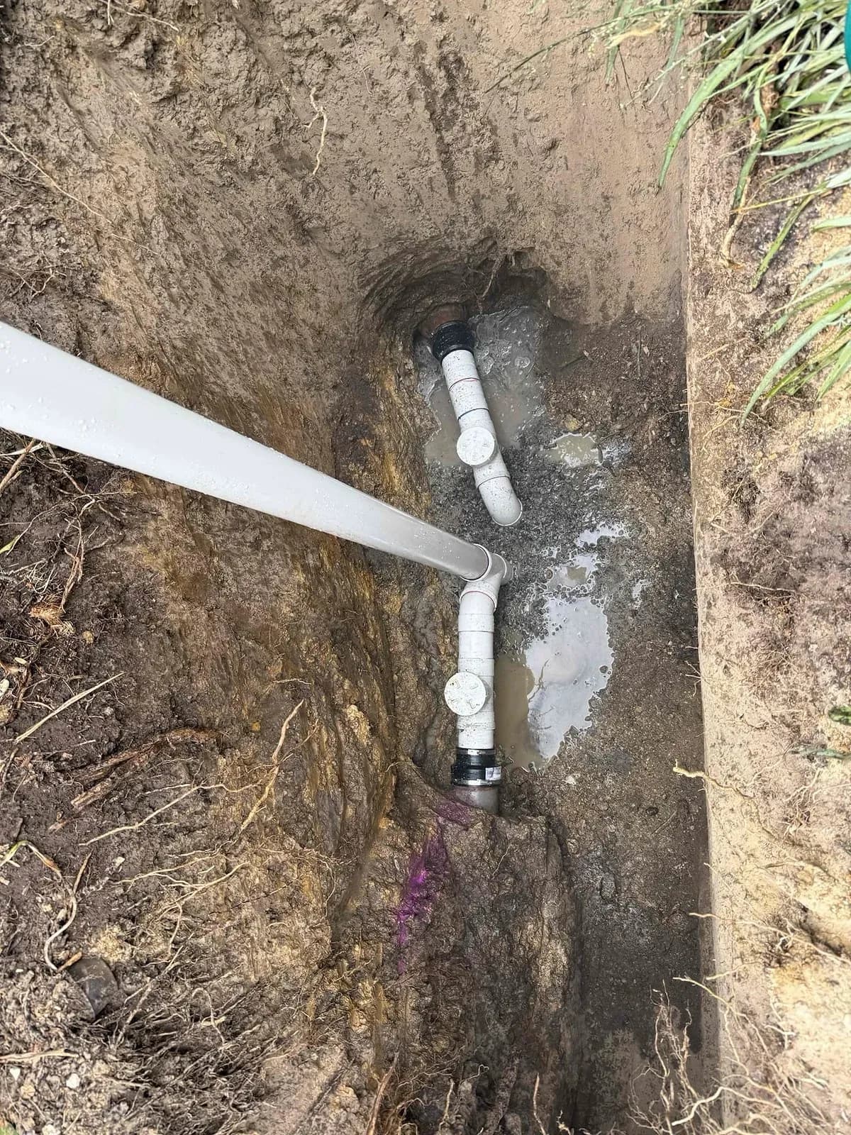 New PVC drain fittings connected in the trench