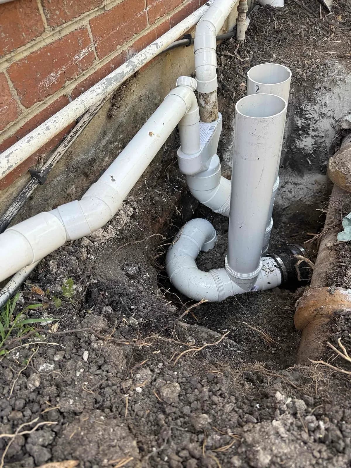 New PVC sewer junctions and inspection shafts in the trench