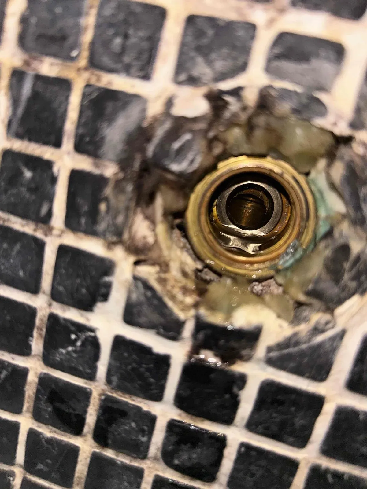 Old shower tap body with worn seals