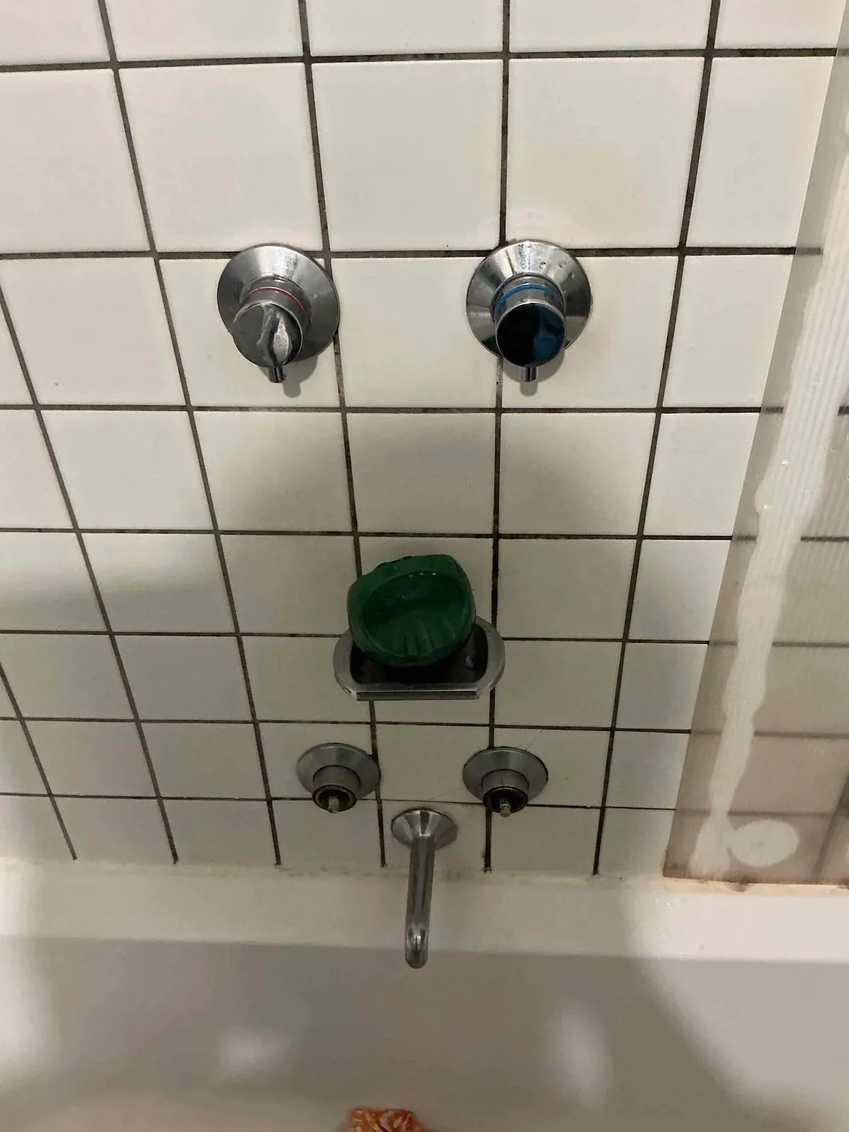 Old bath and shower taps before the repair