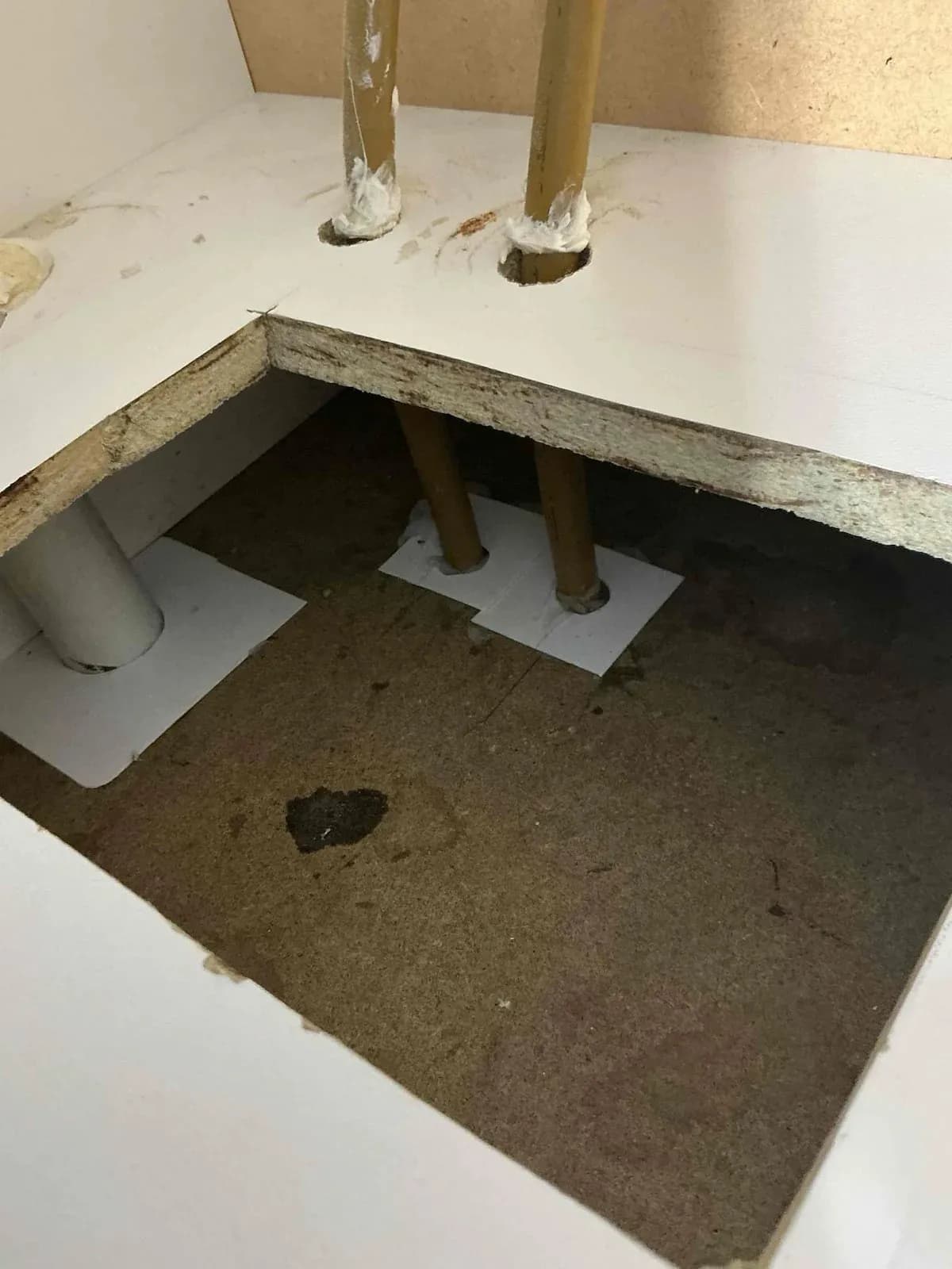 Vanity base opened up to find the source of a sewer smell in Carrum Downs