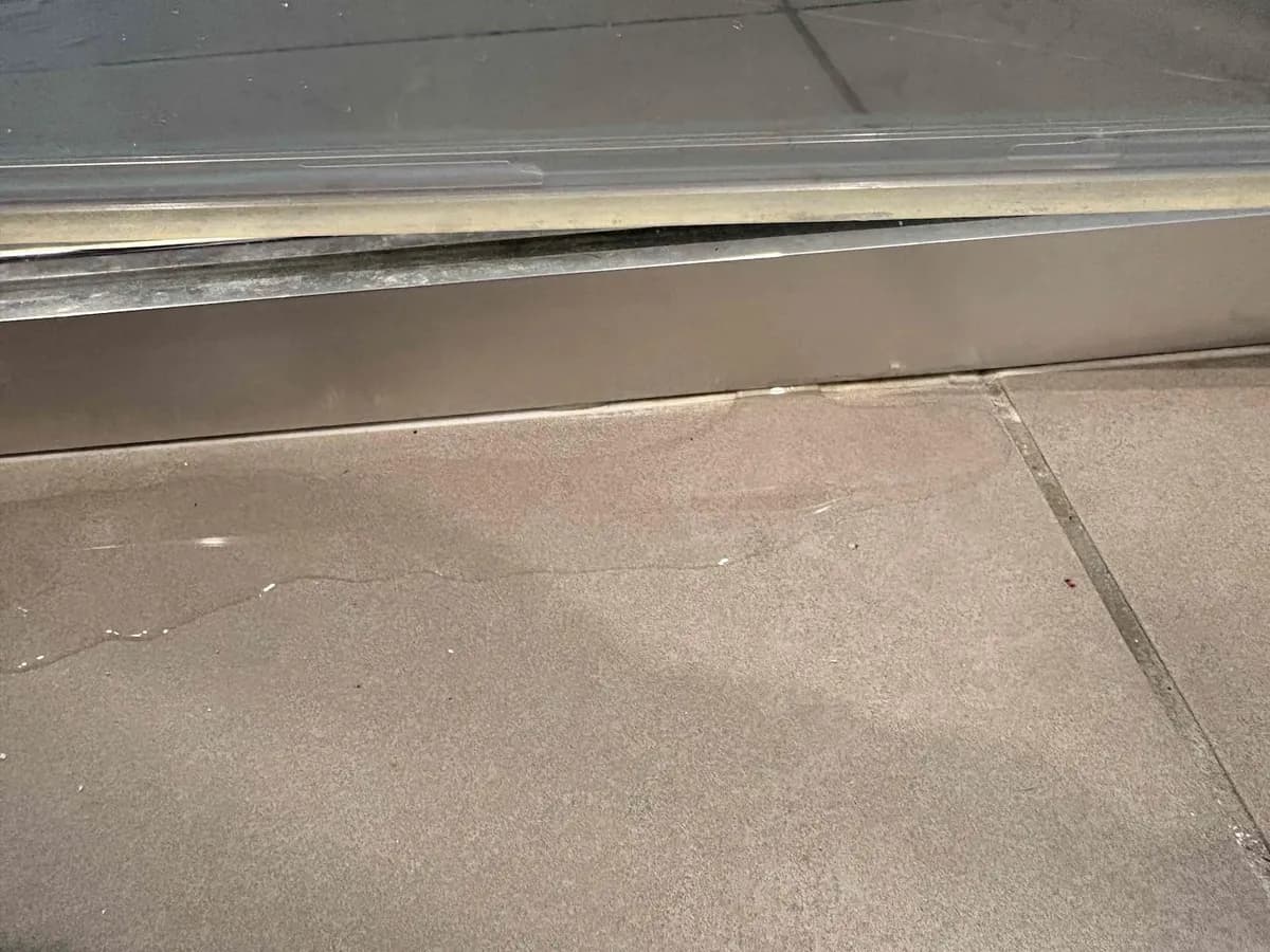 Shower base edge where the silicone had failed