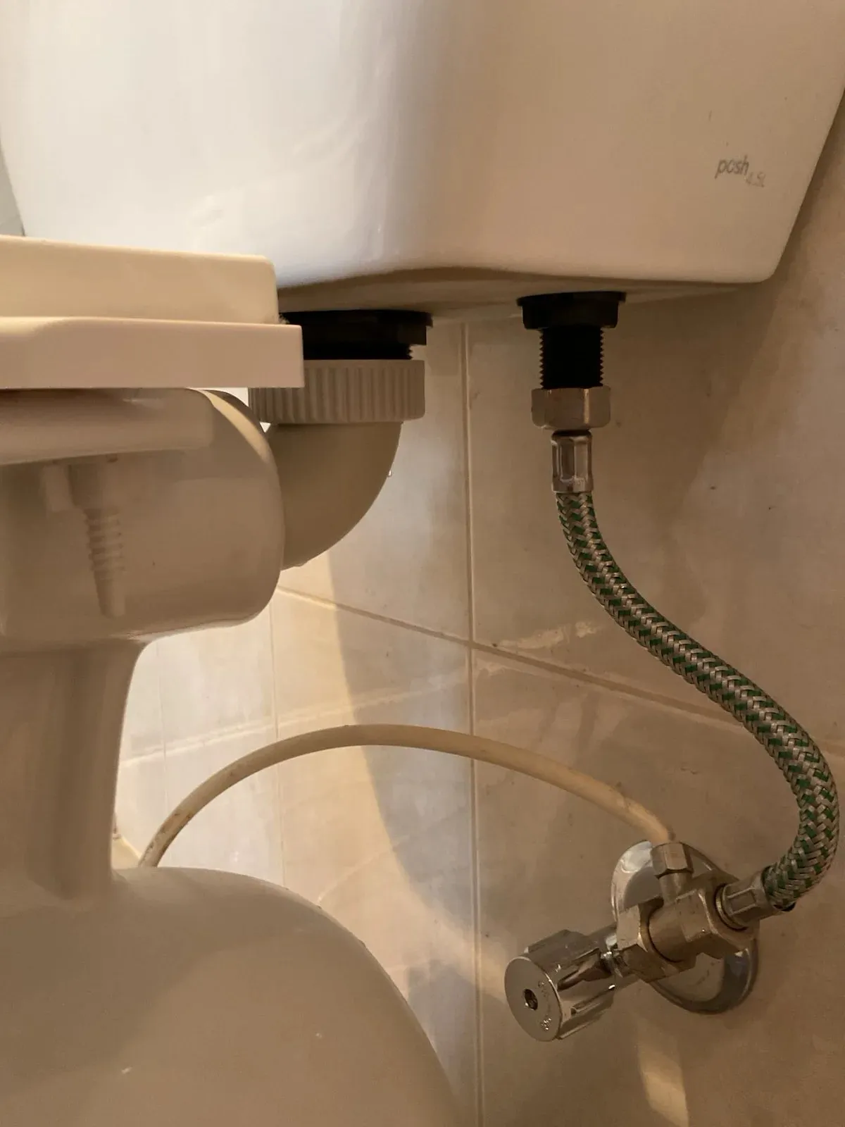 New flexible hose and stop tap connected behind the toilet