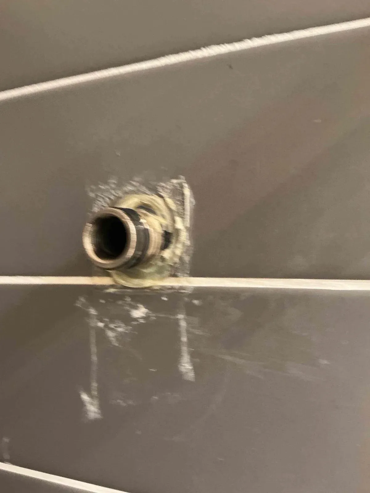 Shower wall with the mixer removed for pressure testing