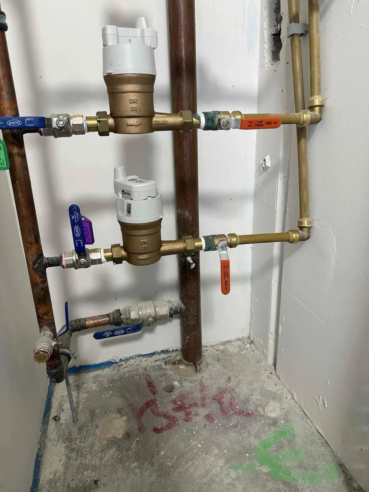 Water meters with new valves in a Collingwood service cupboard