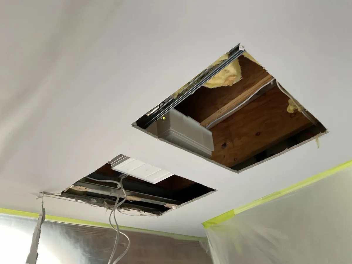 Ceiling below the balcony opened up for leak testing