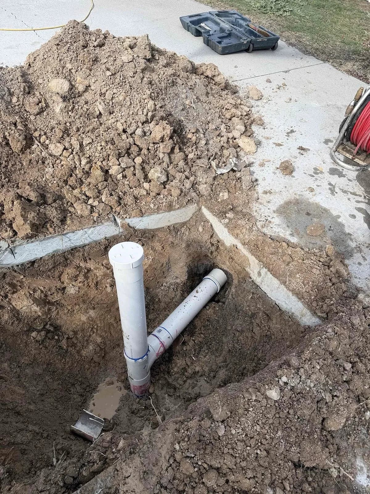 New sewer shaft and riser installed in the dug-out trench