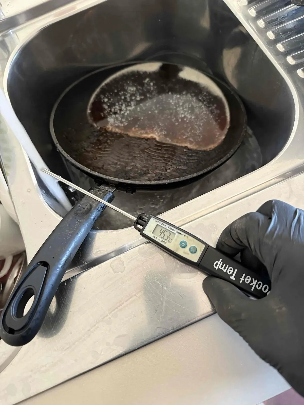 Checking the hot water temperature at the tap