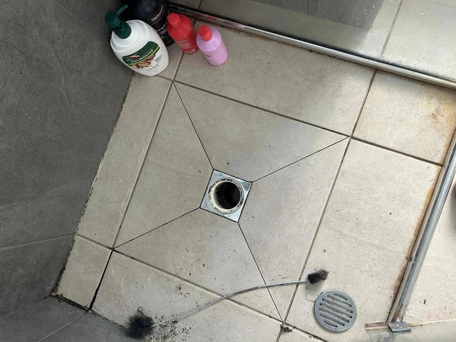 Shower drain opened up for clearing