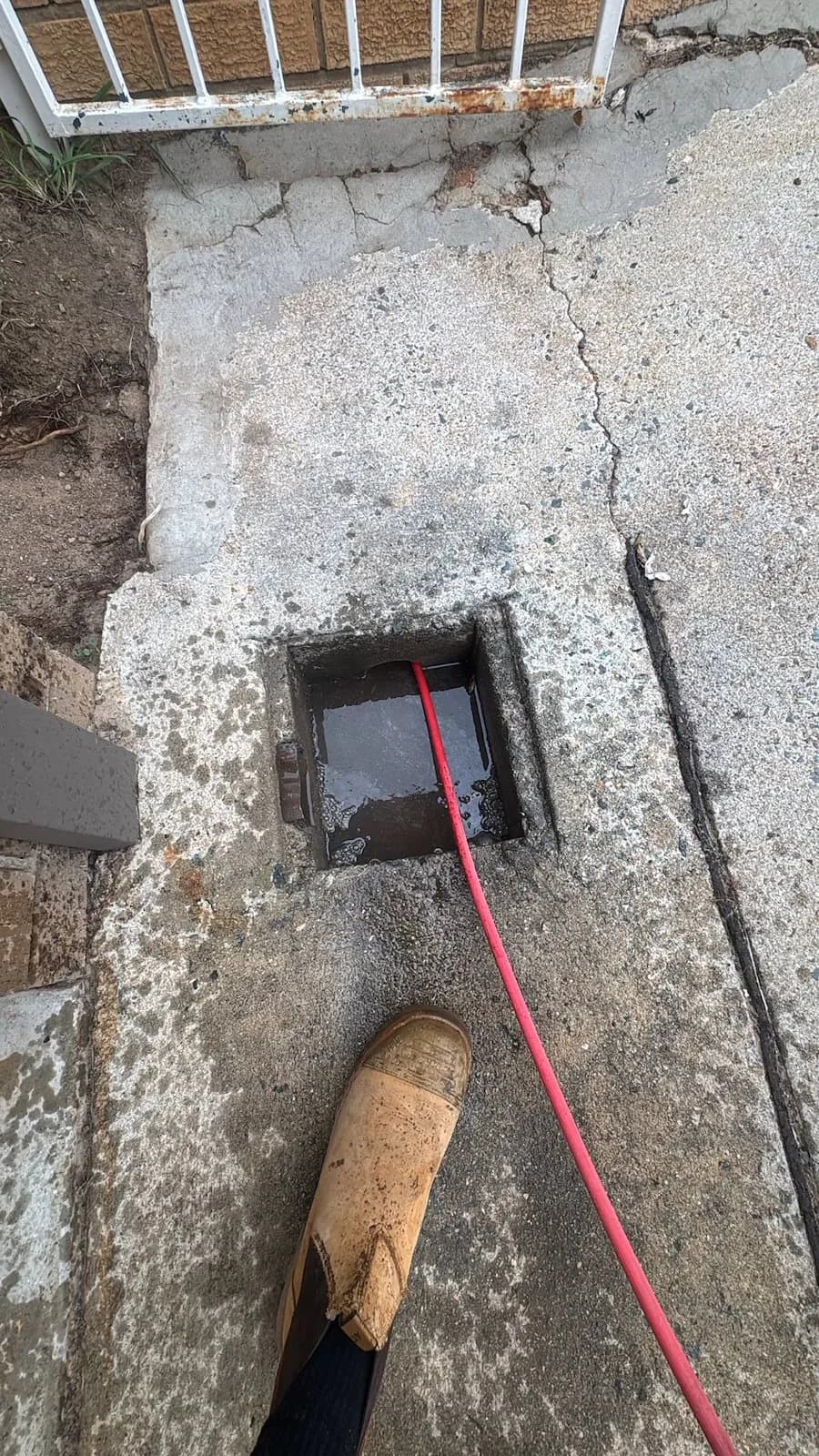 Drain machine cable clearing the stormwater pit
