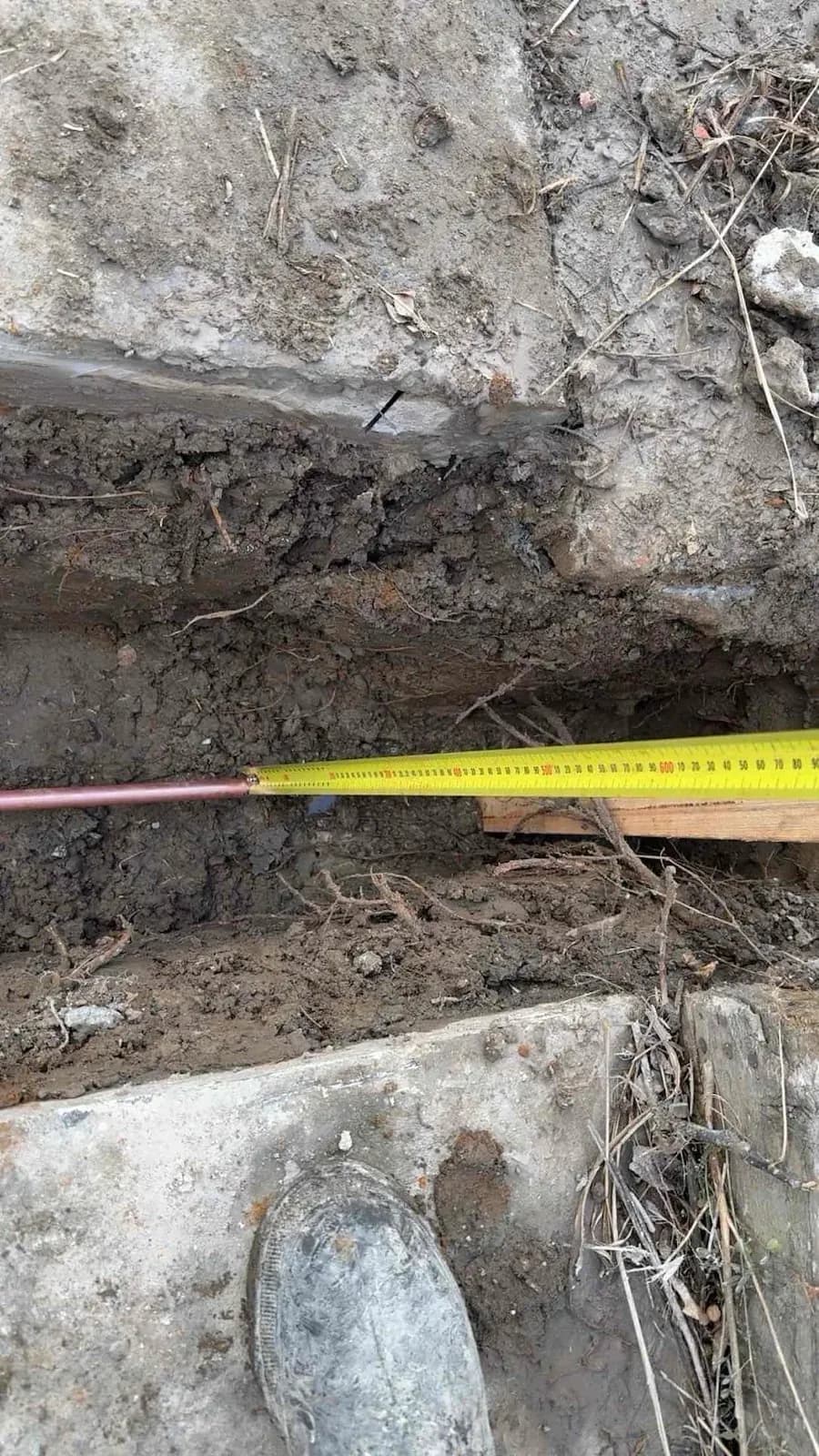 Trench dug for the new water line from the meter