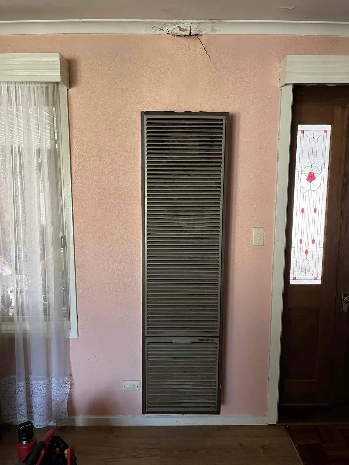 Old gas wall furnace before removal