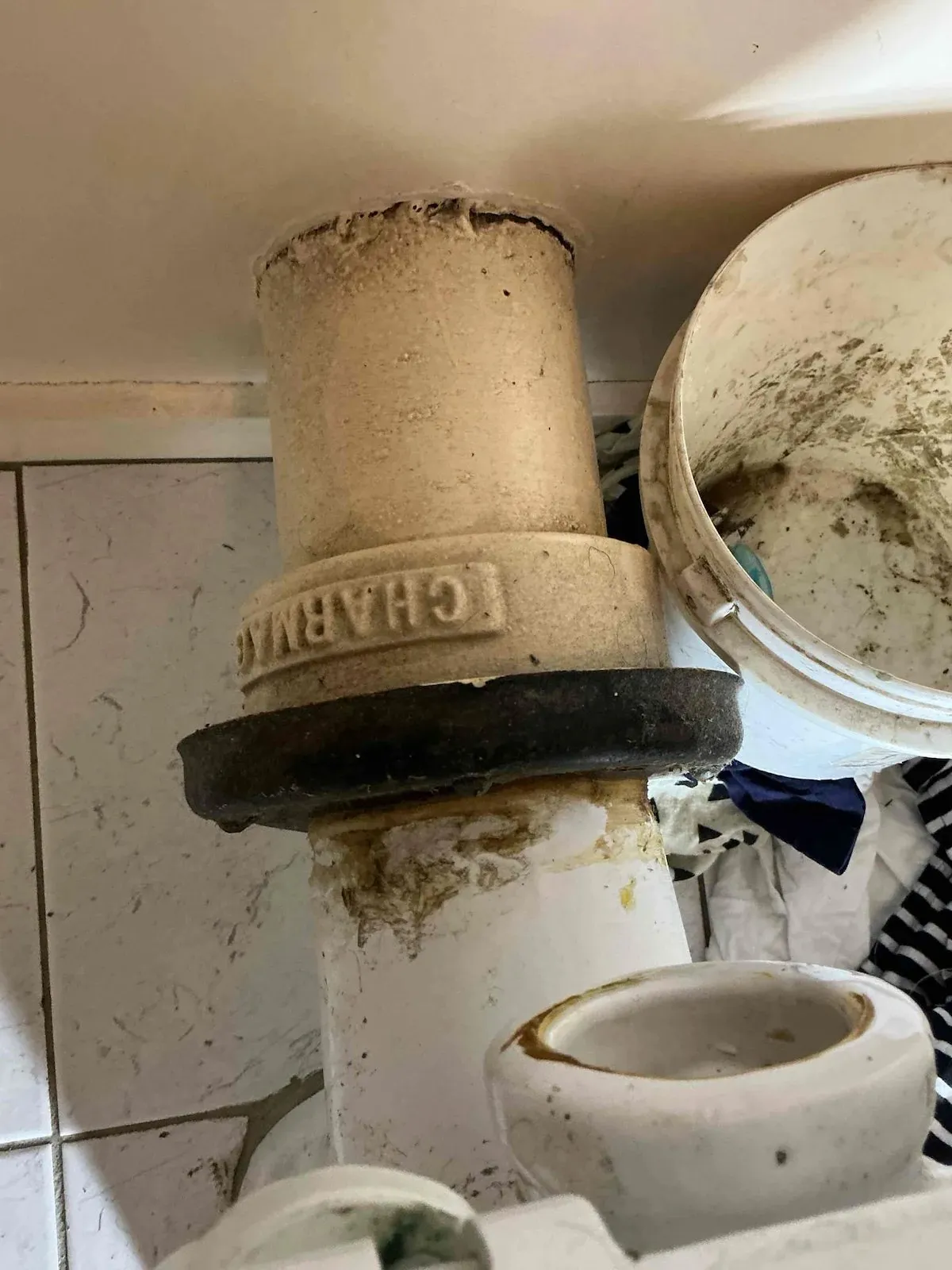 Old cast iron toilet waste before replacement