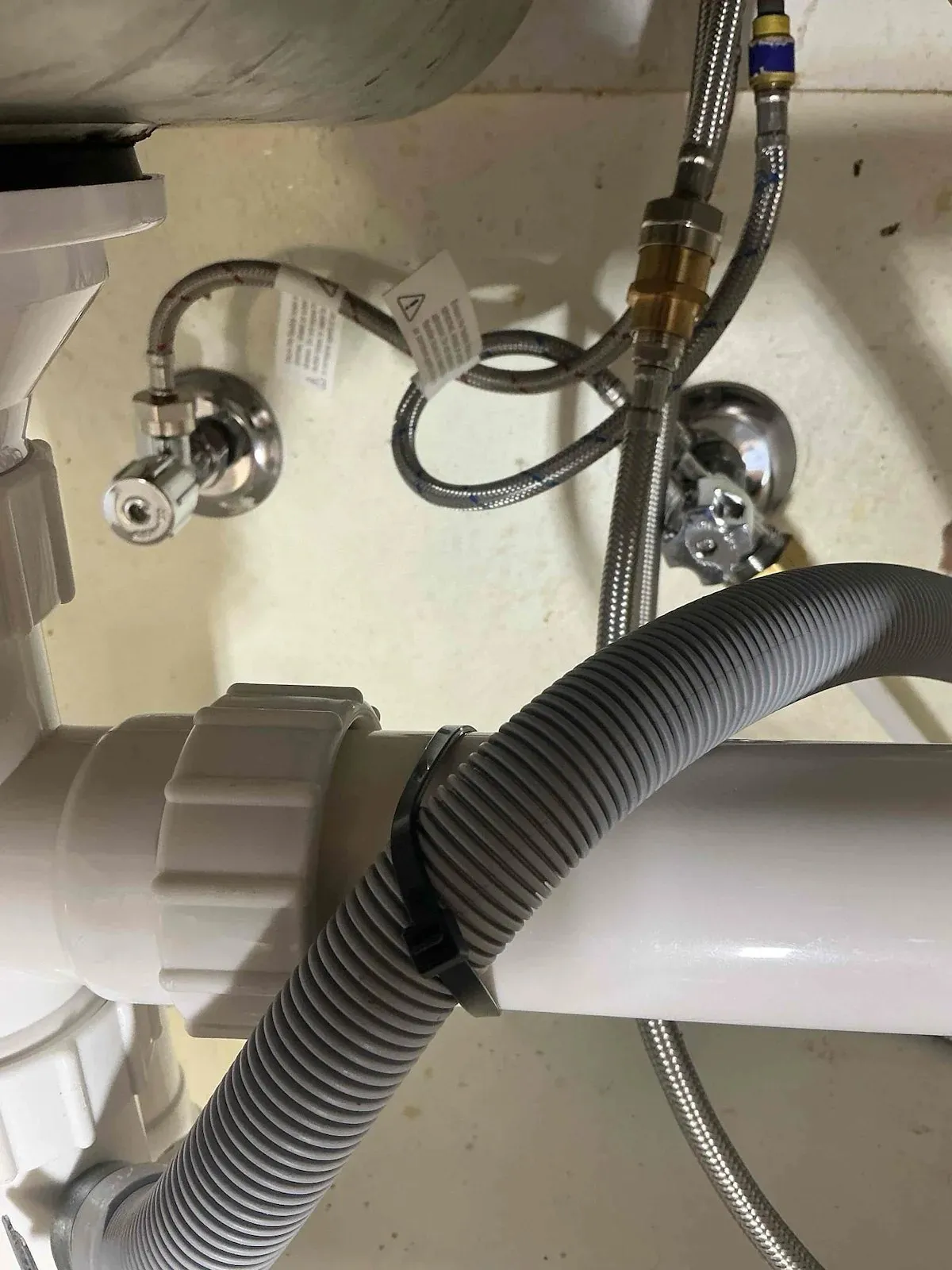 New tap connections and hoses under the sink