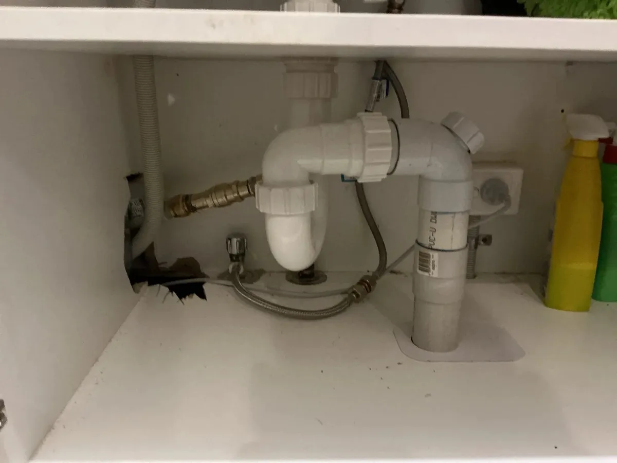 New trap and dishwasher connection under the sink