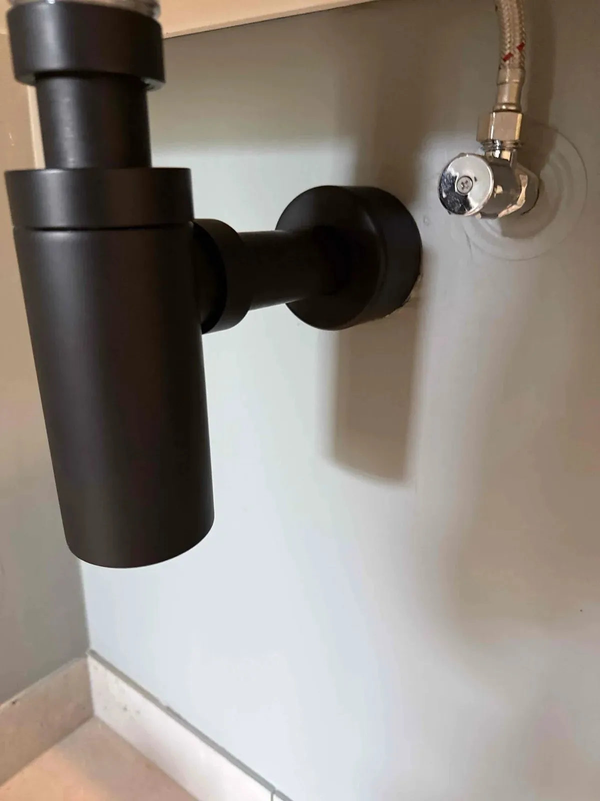 New bottle trap fitted under the basin
