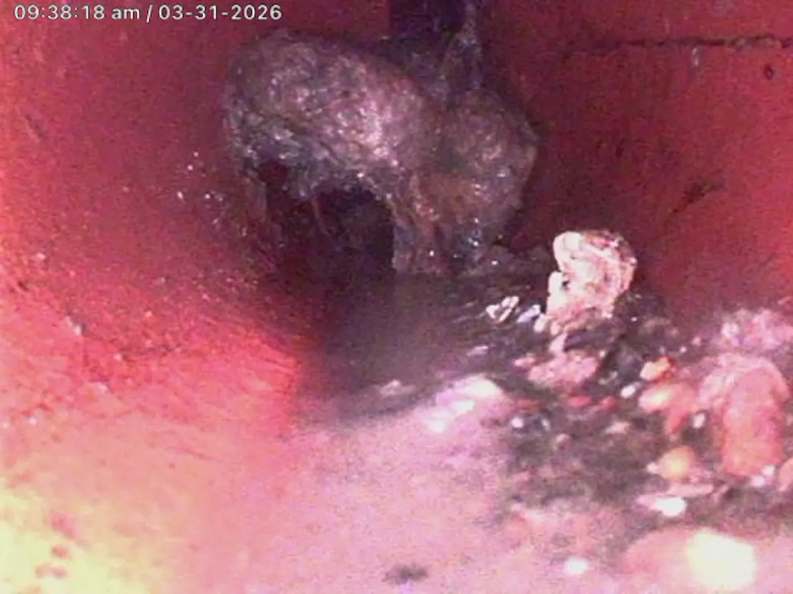 Drain camera view of the blockage inside the sewer pipe