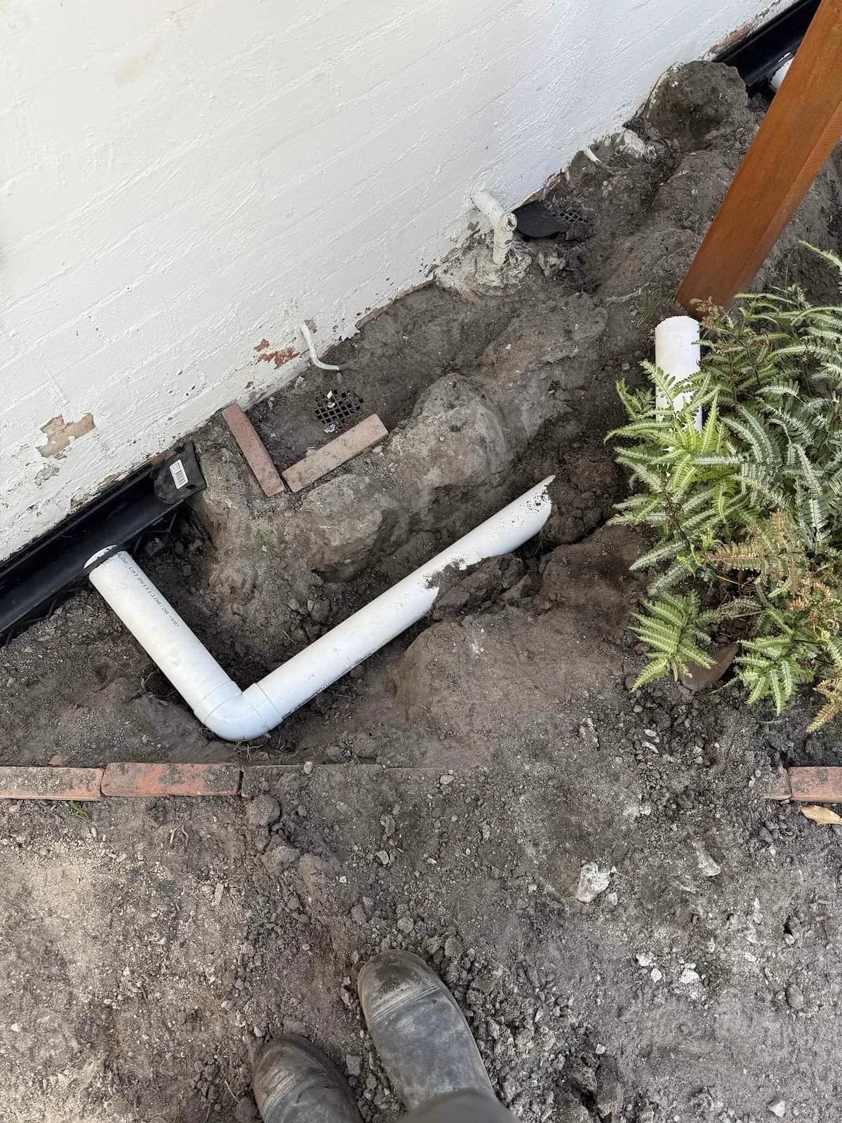 New stormwater pipework being laid in the garden bed
