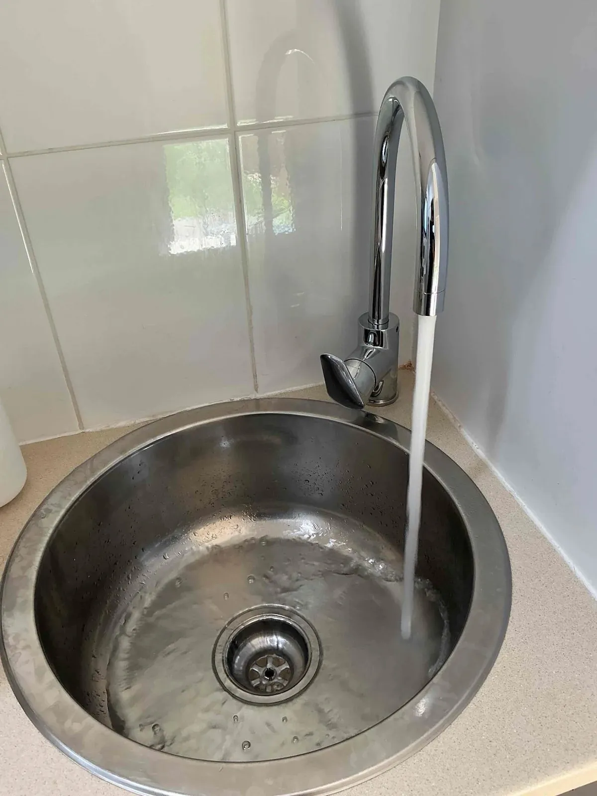 New gooseneck mixer on the laundry sink