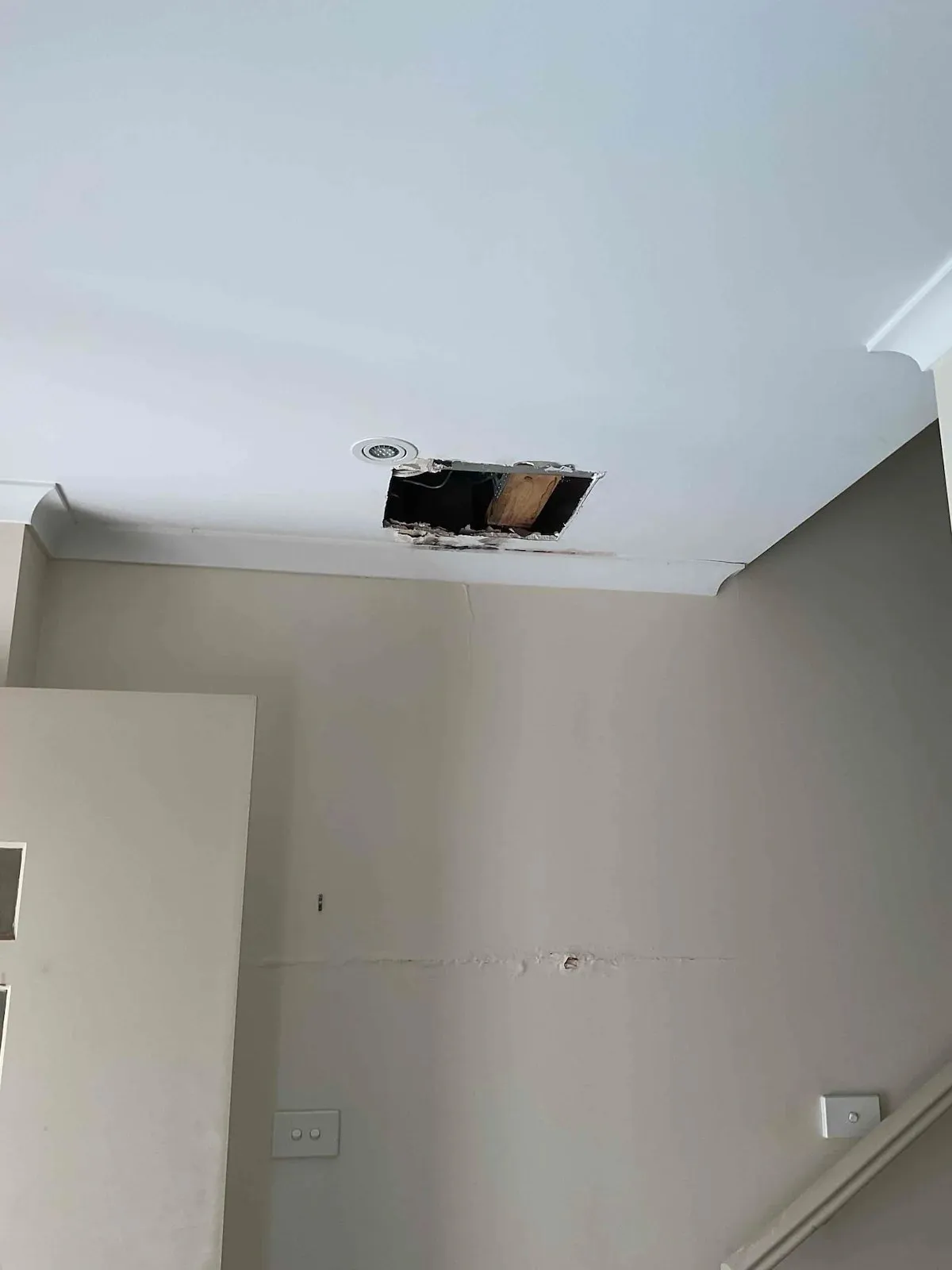 Ceiling opened up below the upstairs bathroom