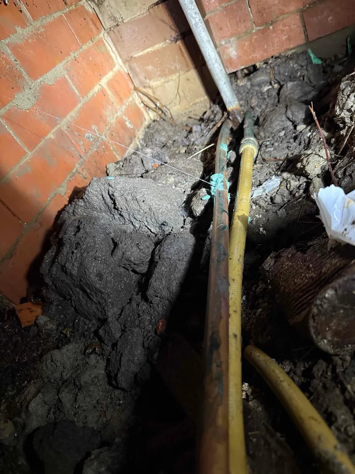 Water pipe run along the subfloor wall