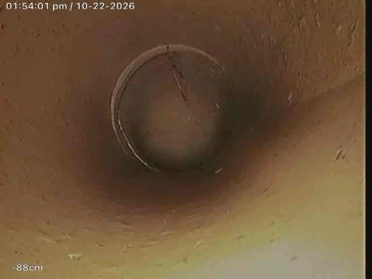 Drain camera view of a pipe joint further down the line