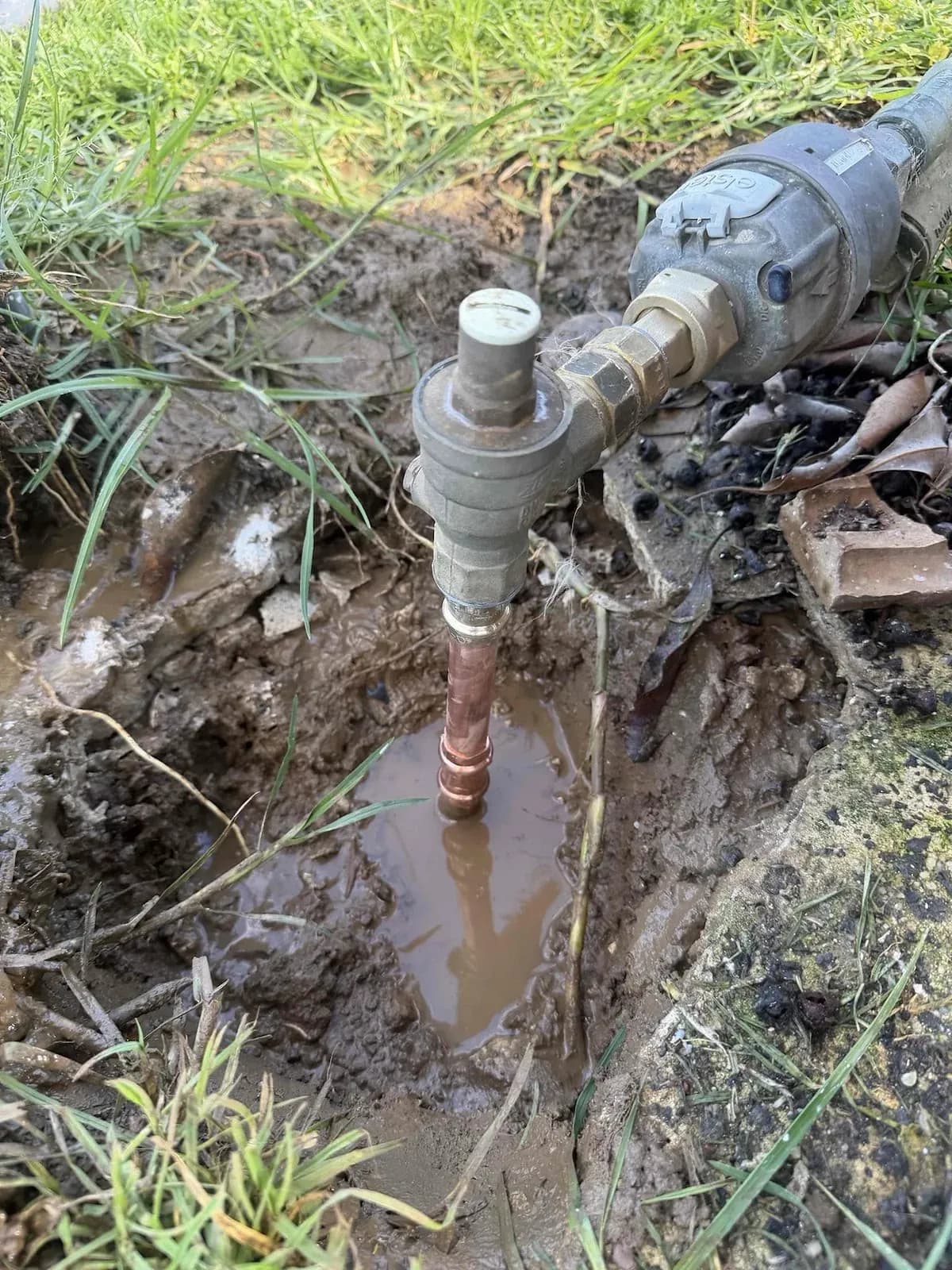 Water pooling around the pipe under the meter
