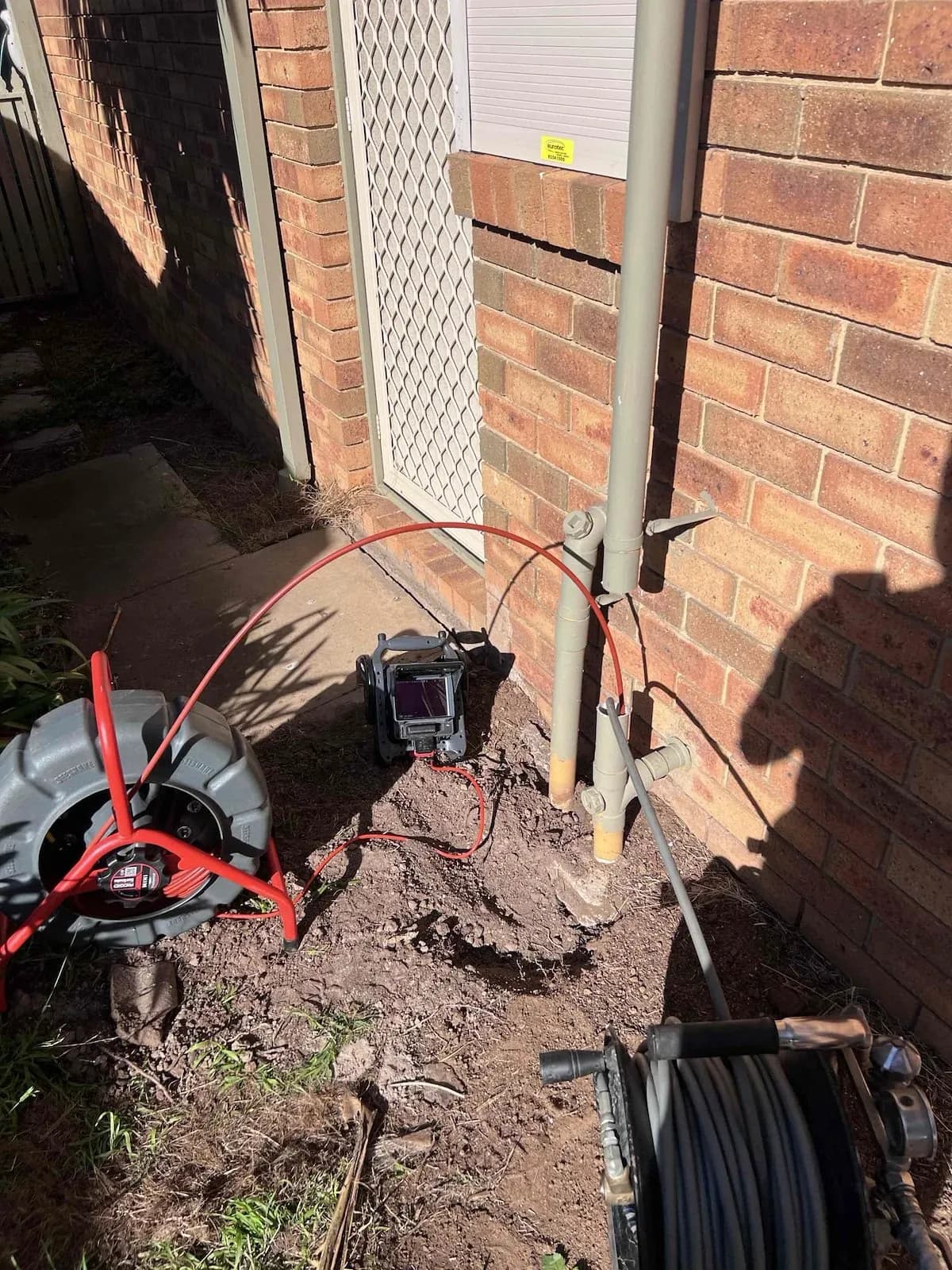 Drain jetting gear set up beside the house