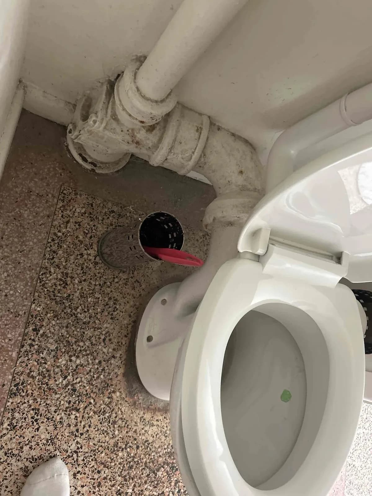 Toilet waste and riser pipework under a house