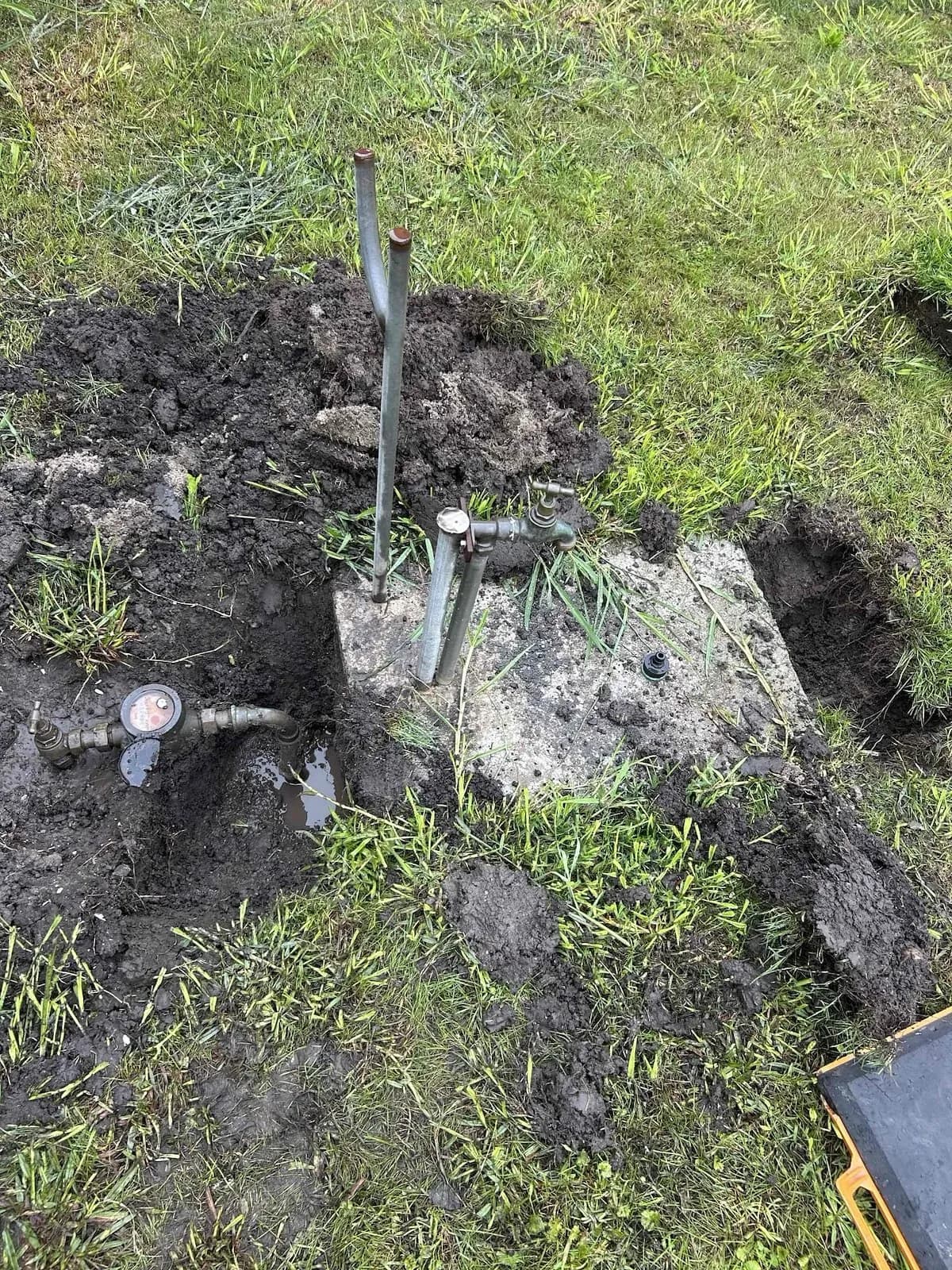 Dug down to the burst pipe near the water meter