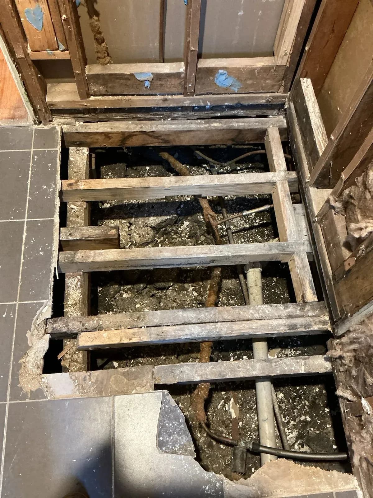 Floor opened up to cap the old lines