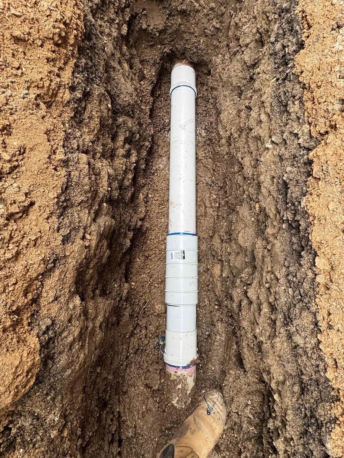 New PVC stormwater pipe laid in the trench