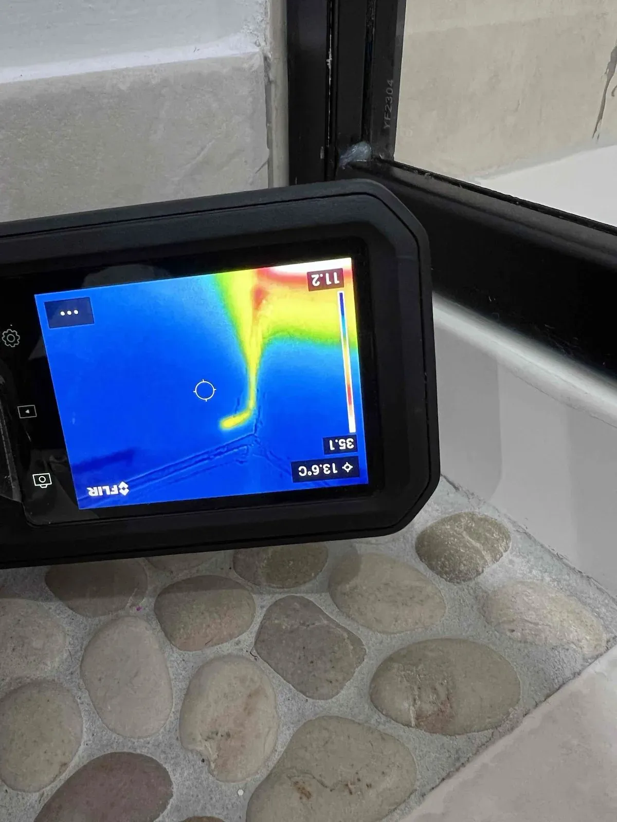 Thermal camera checking the shower wall