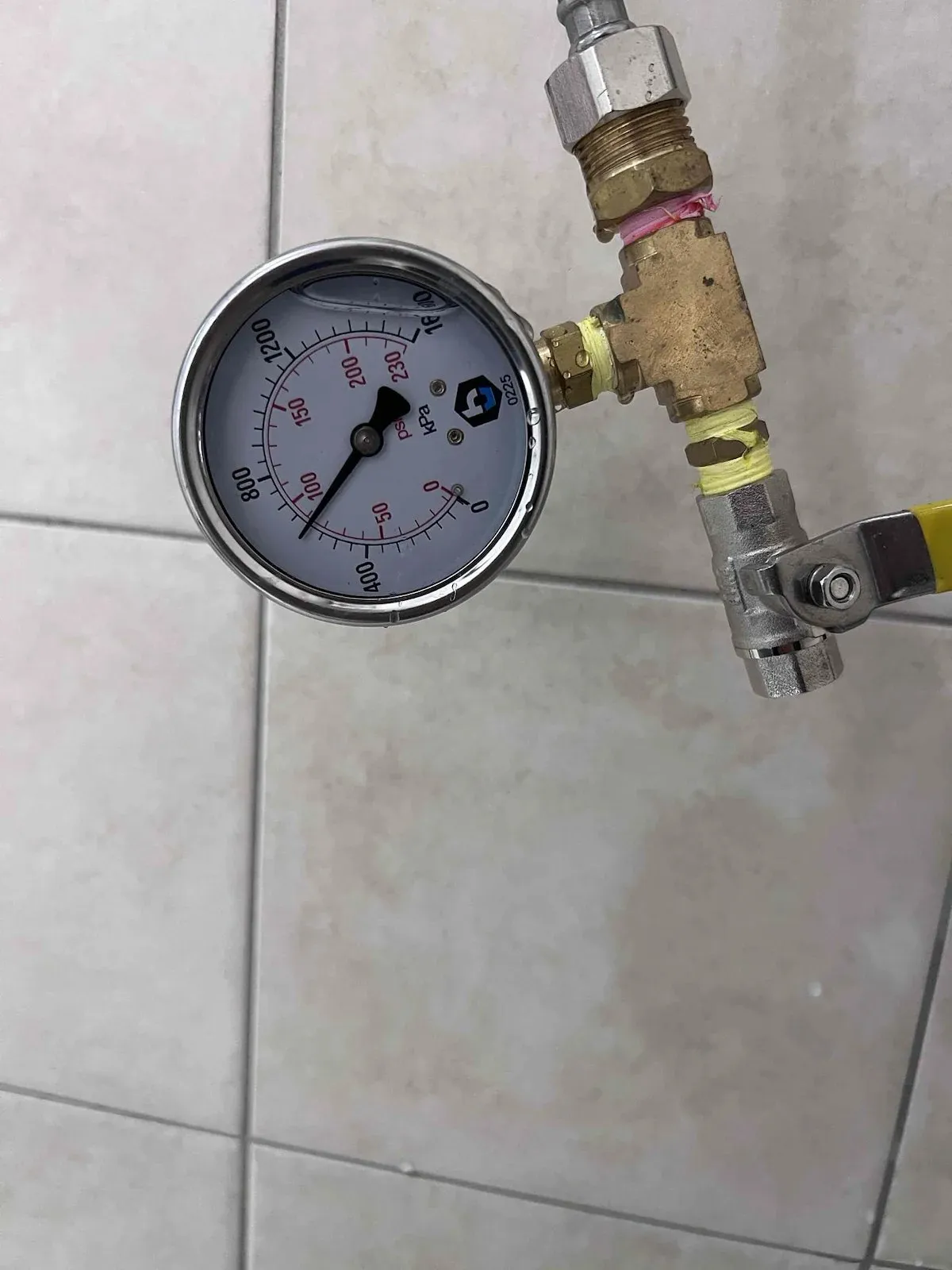 Pressure gauge testing the shower water lines