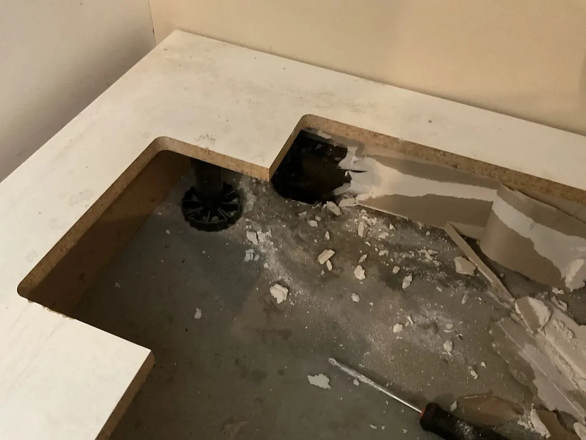 Opened cabinet floor where the failed mini stop was found