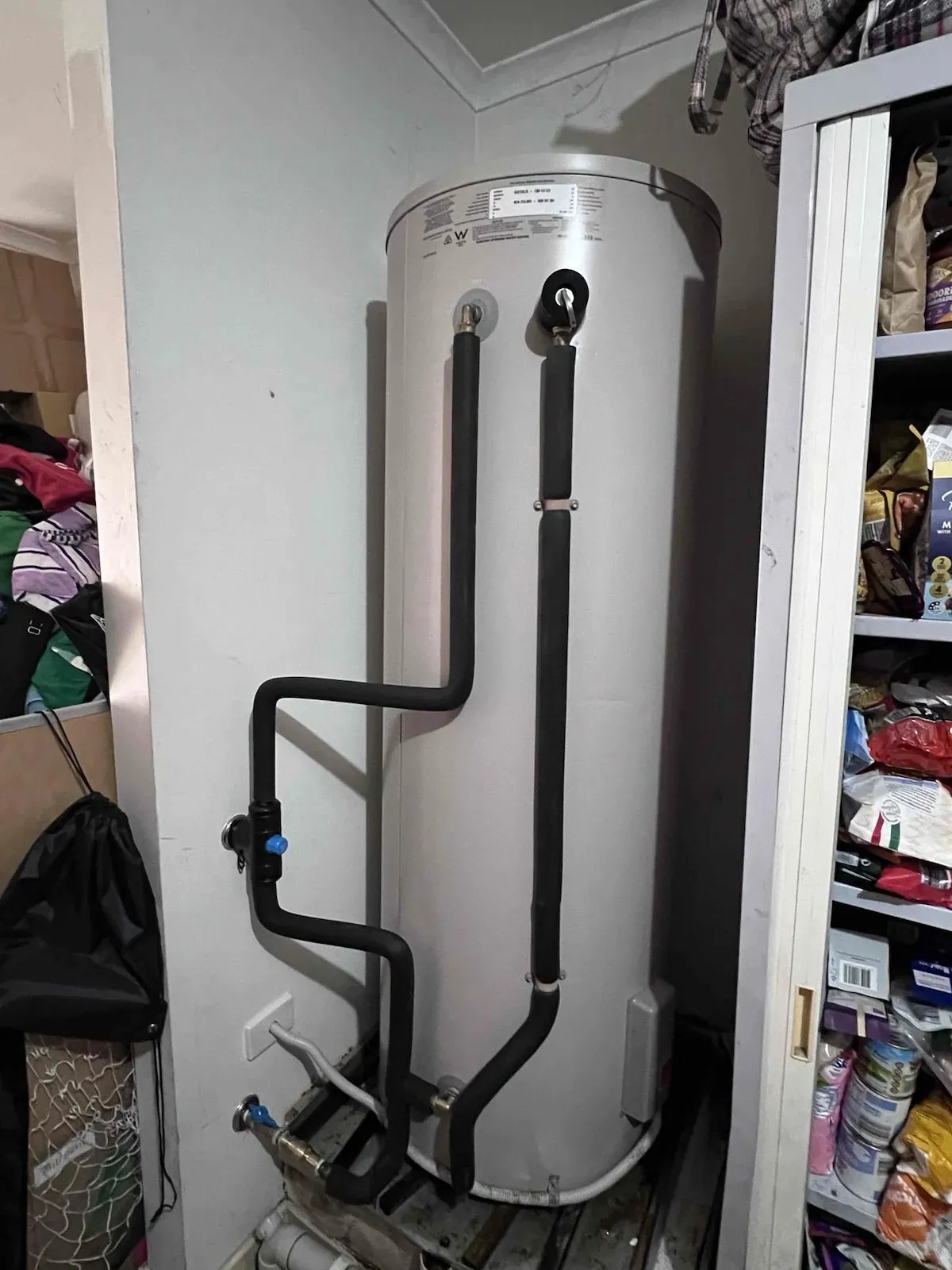 New electric hot water unit installed in the cupboard