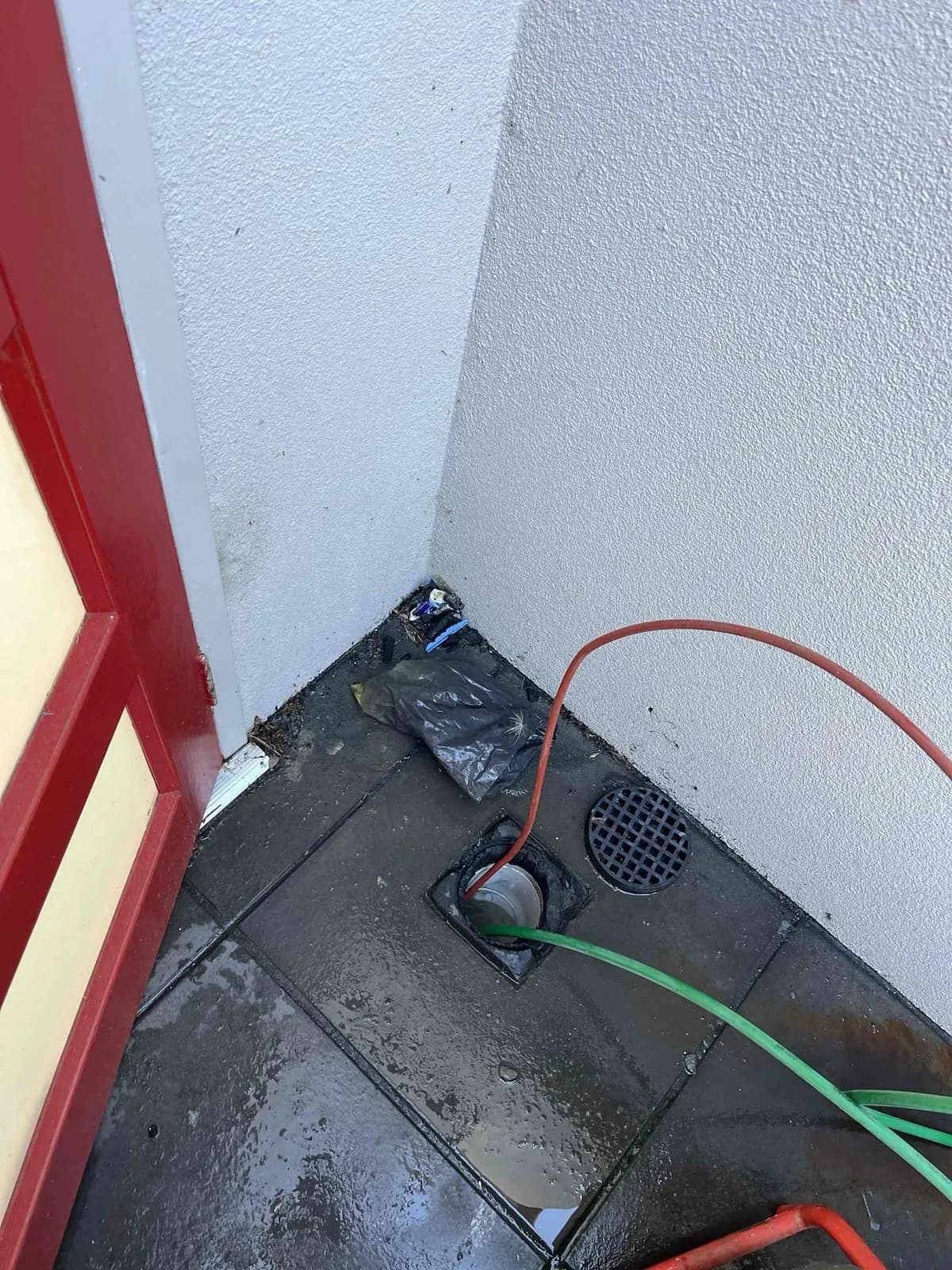 Courtyard drain being cleared before relining