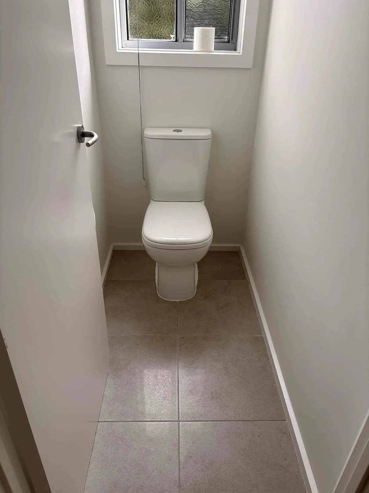 New toilet suite in a tiled toilet room