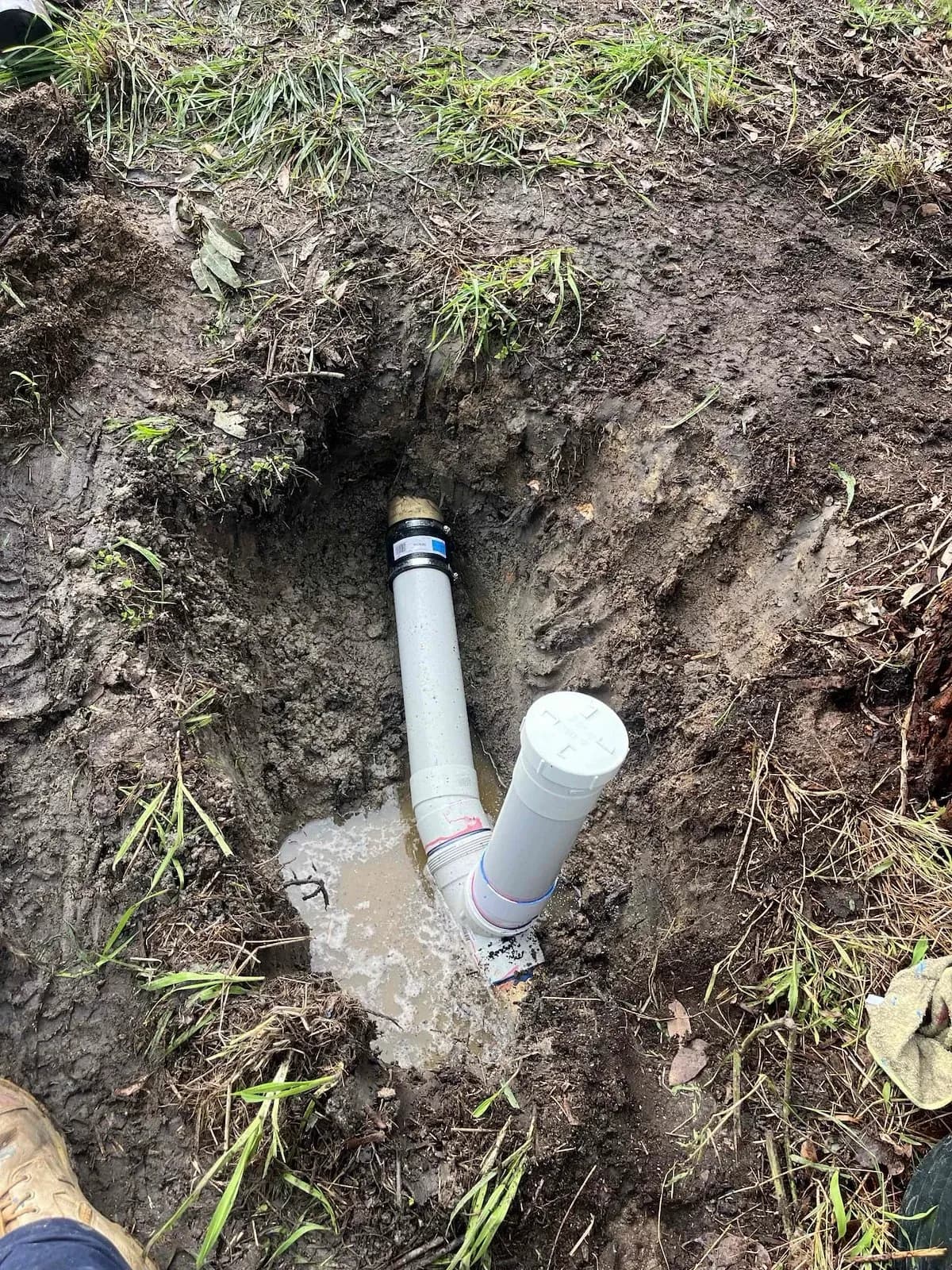 New PVC sewer section with a fresh inspection point