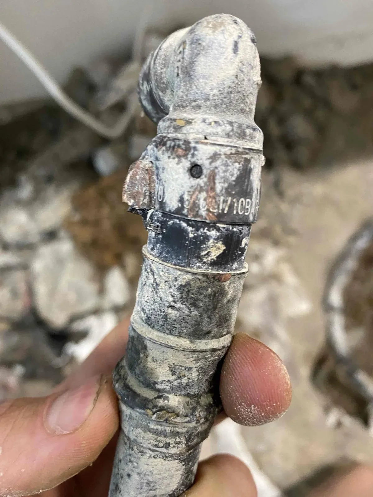 Corroded copper water pipe dug out from under the slab