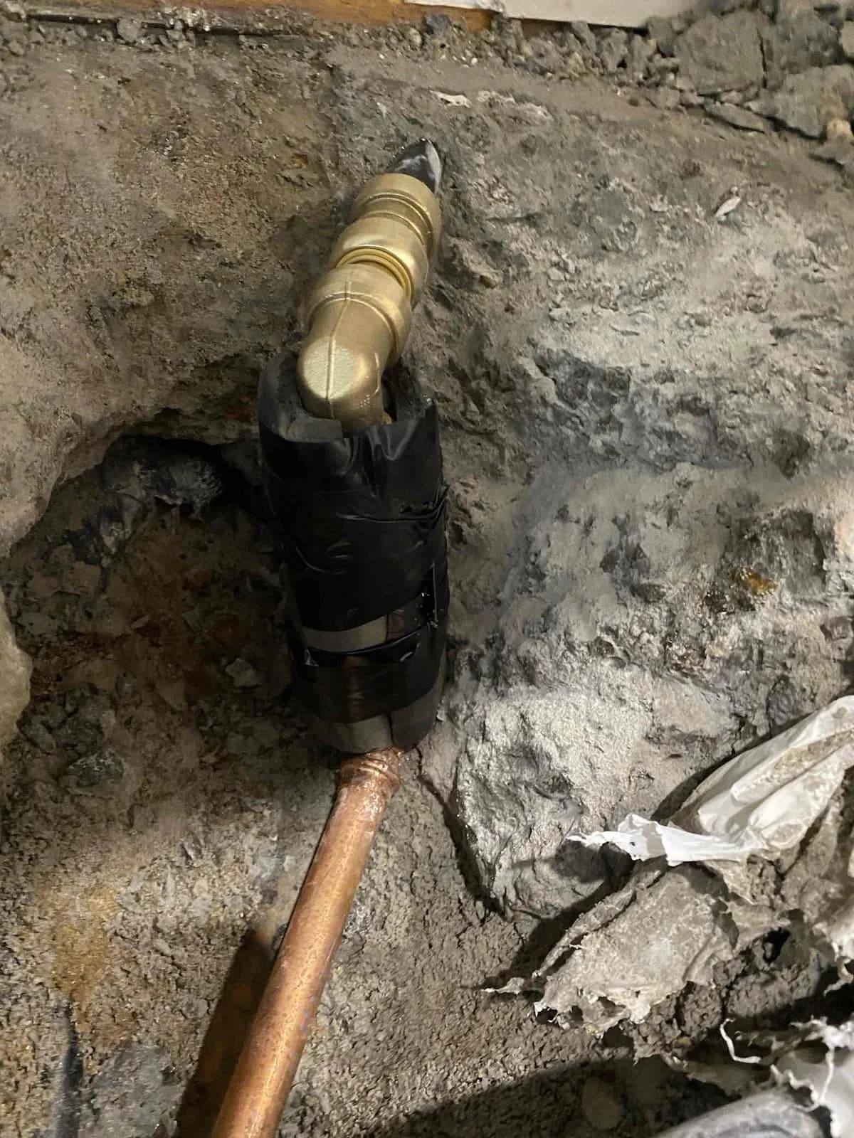 New fitting and copper section in place before the concrete went back