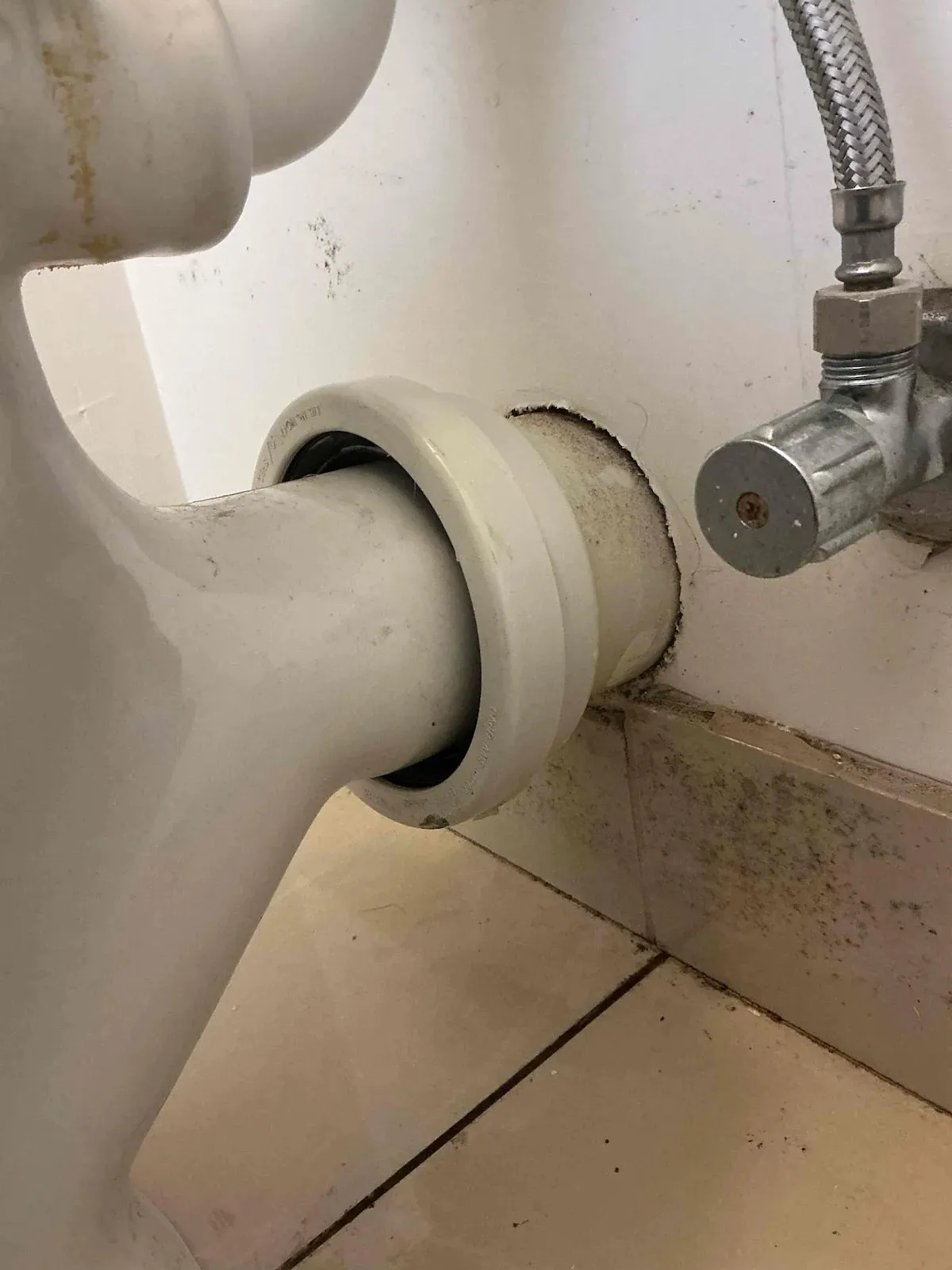 Toilet pan connection to the wall